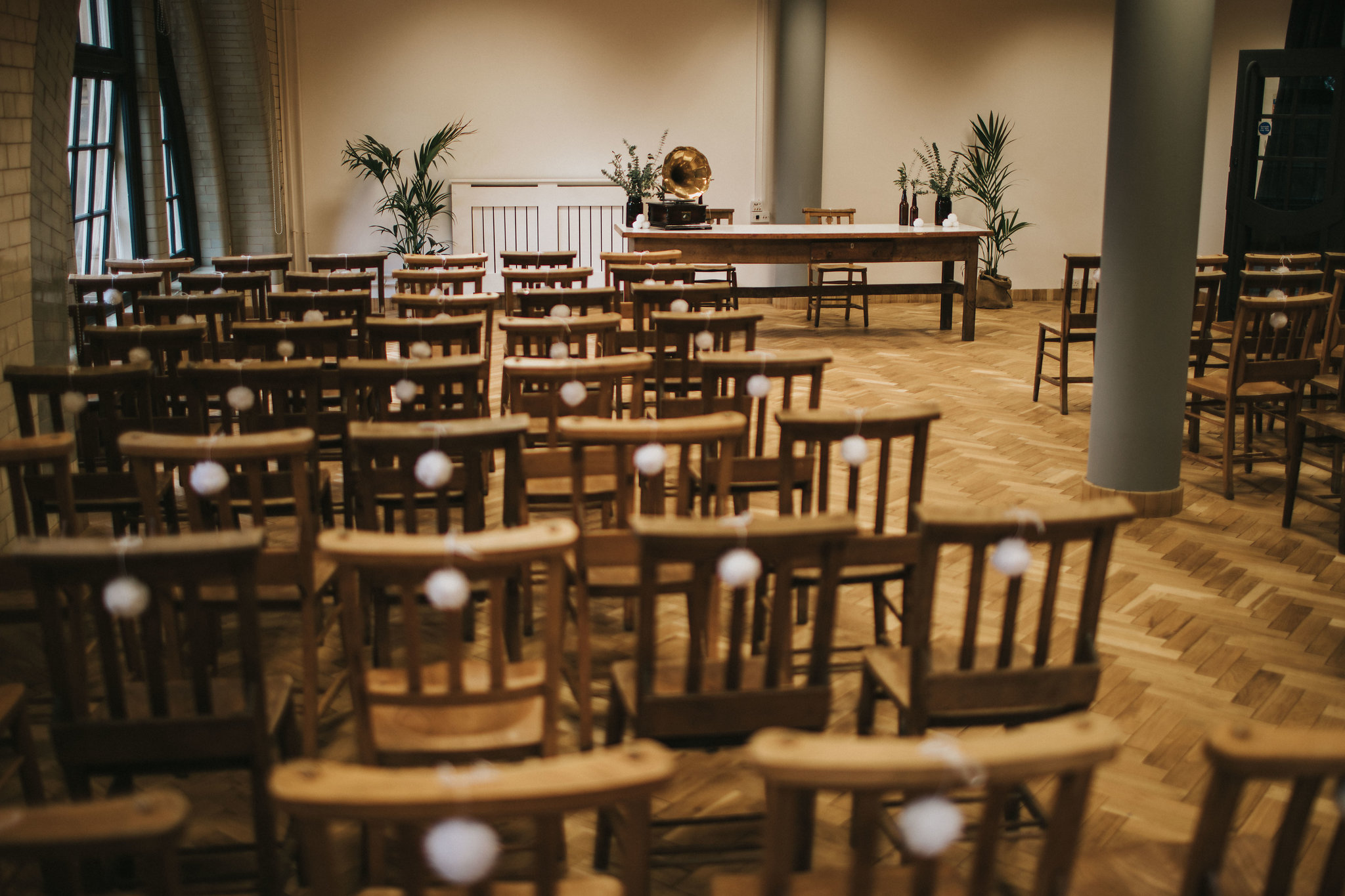 Ollerton Room event space with wooden chairs, ideal for meetings and presentations.
