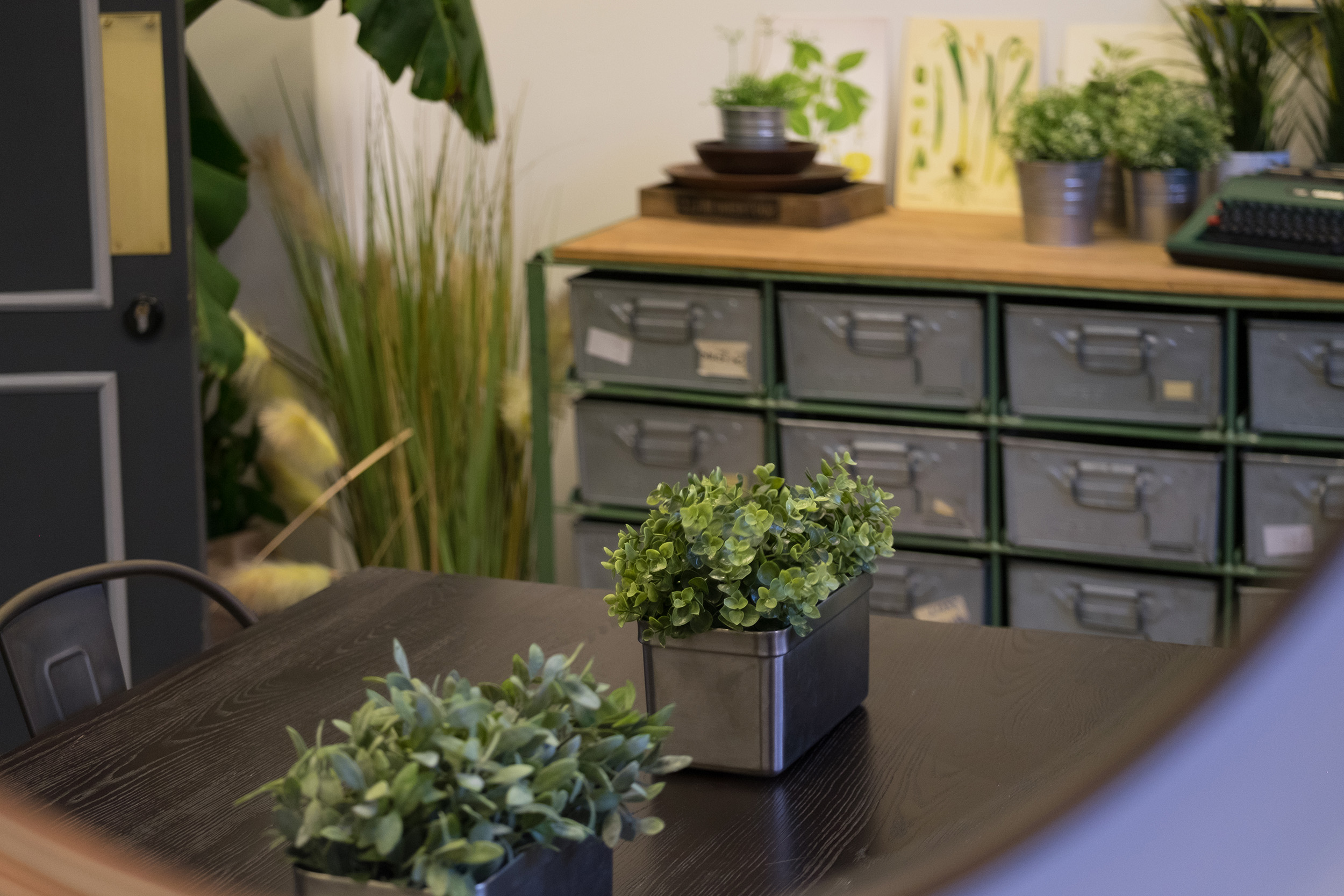 Themed meeting room with greenery for creative brainstorming sessions at The Pumping House.