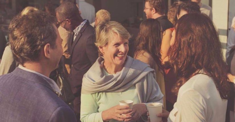 Vibrant networking event at The Pumping House with engaged attendees and casual attire.