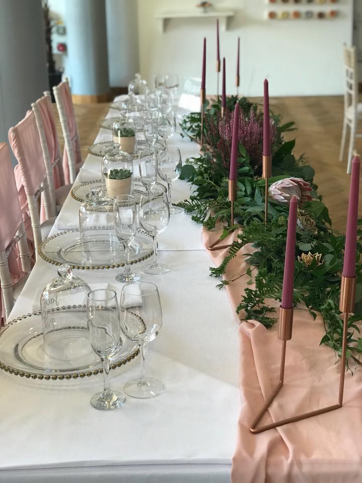Elegant event table with glassware and pink accents at The Pumping House.