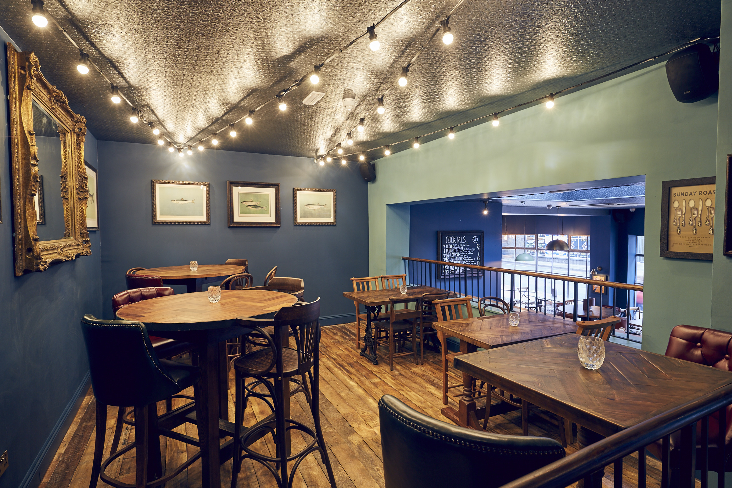 Cozy event space with warm lighting at East Putney Tavern for gatherings and receptions.