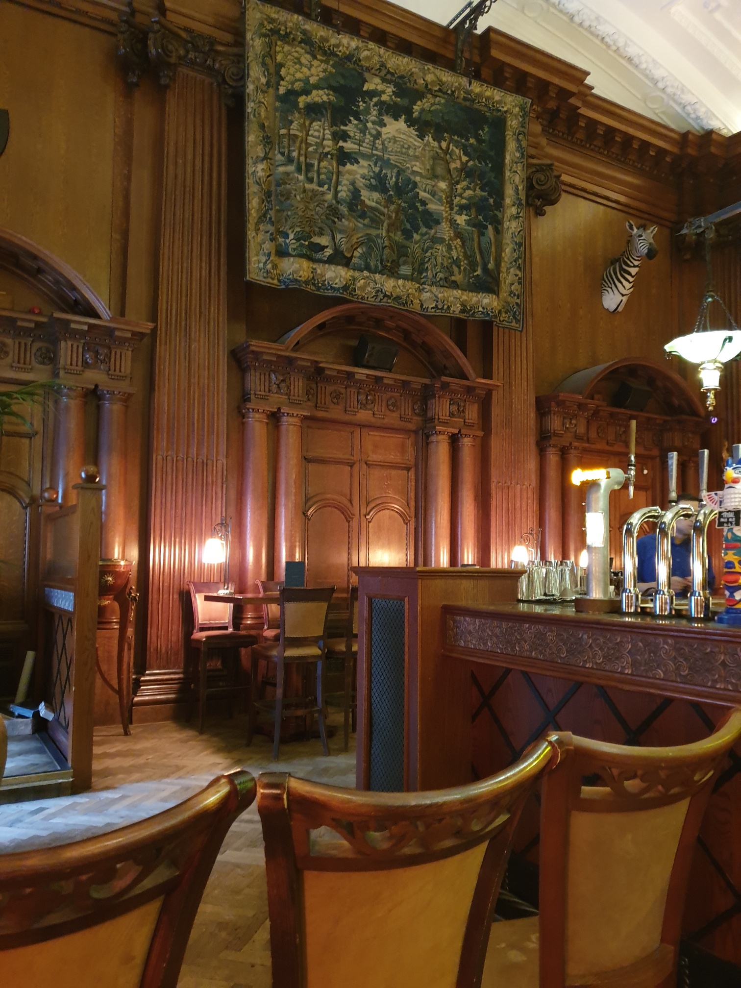 Sophisticated venue with wooden paneling, ideal for upscale events and gatherings.