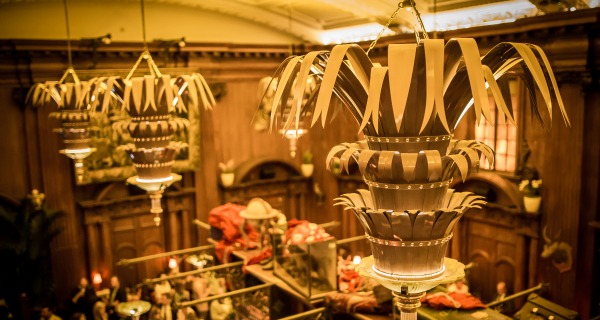 Elegant event space at The Mezzanine, featuring ornate chandeliers for corporate gatherings.