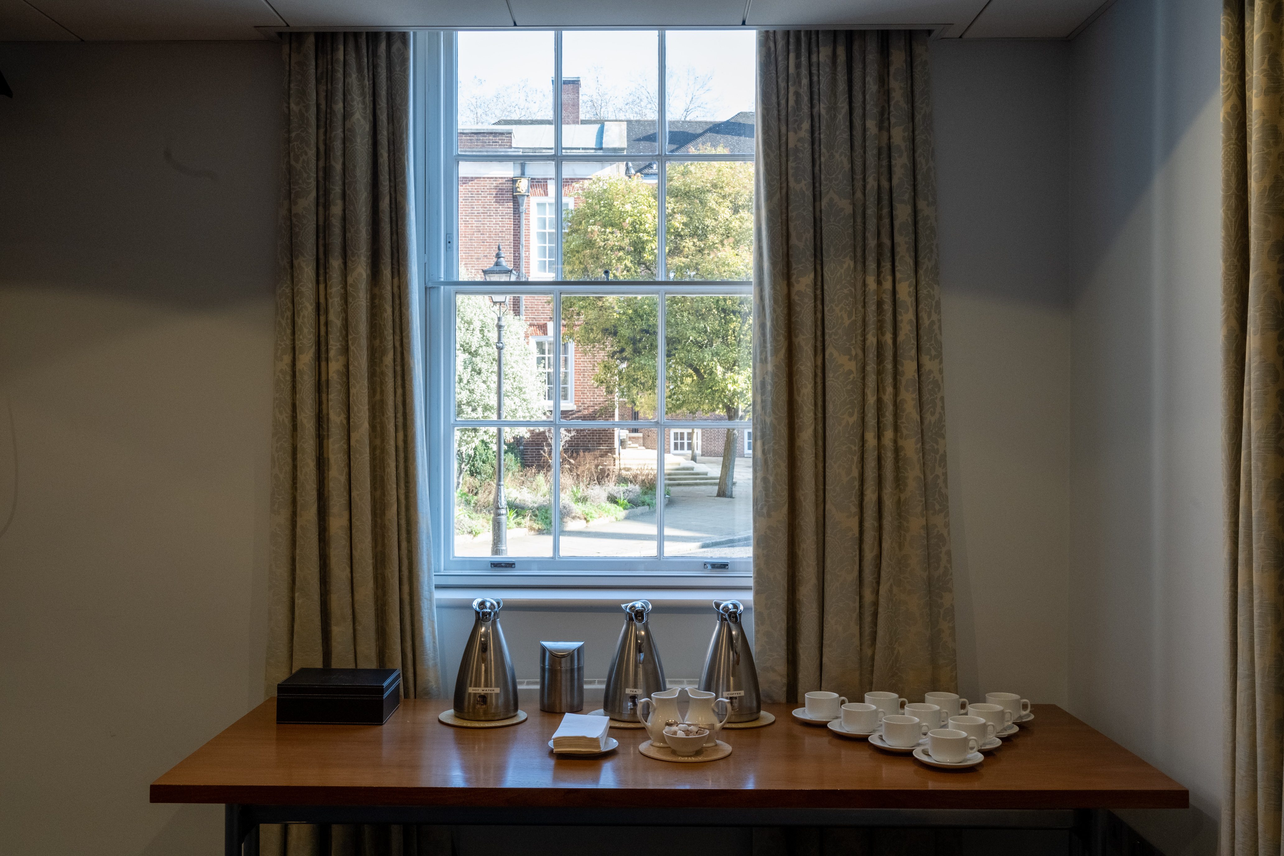 Rose Heilbron Room refreshment station with coffee dispensers for networking events.