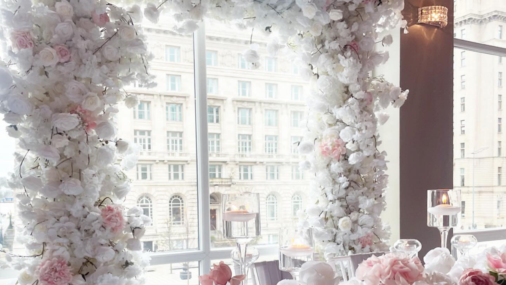 Cunard Suite at The Bentley with floral arch, ideal for weddings and upscale events.