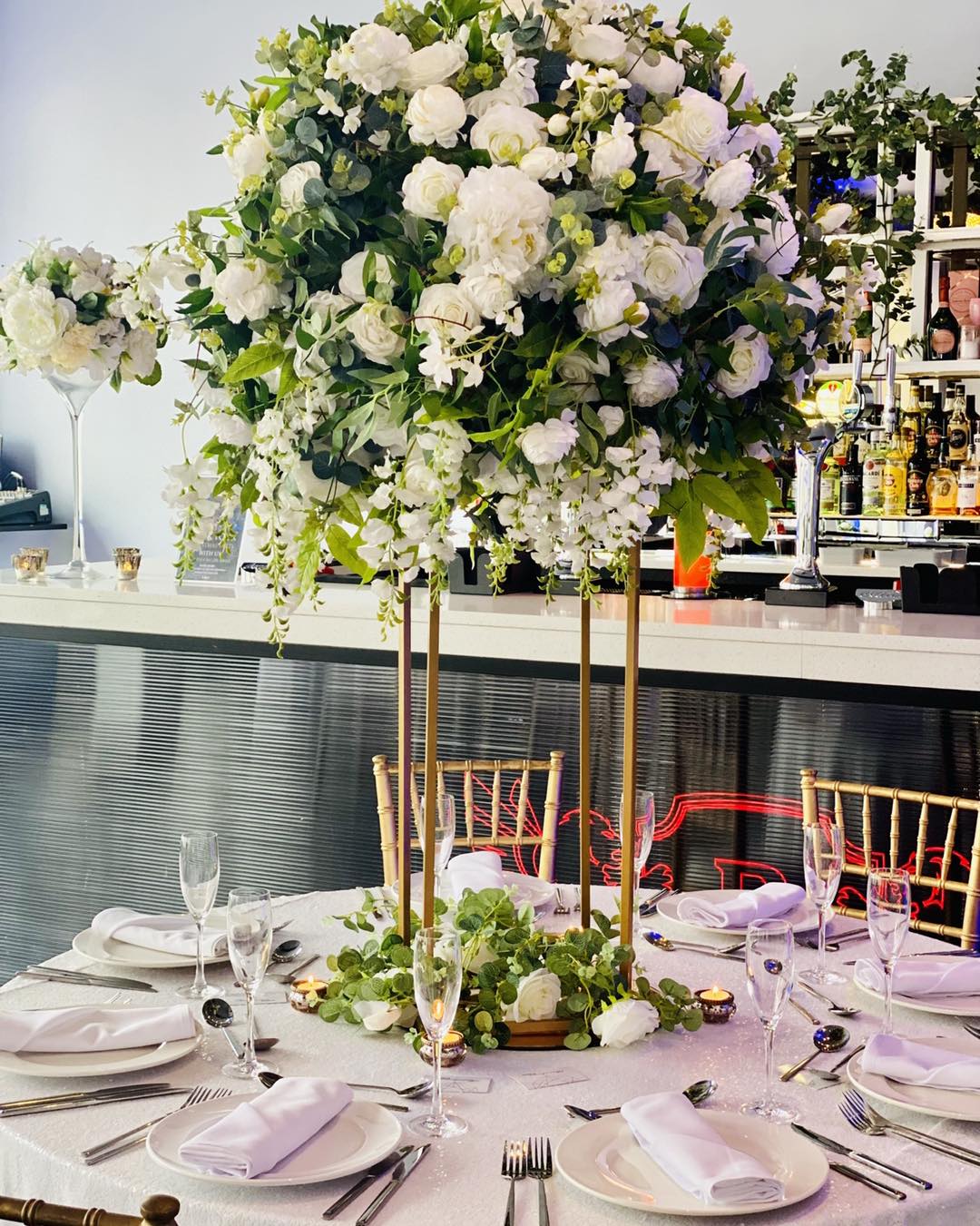 Cunard Suite table with floral centerpiece for upscale events and celebrations.