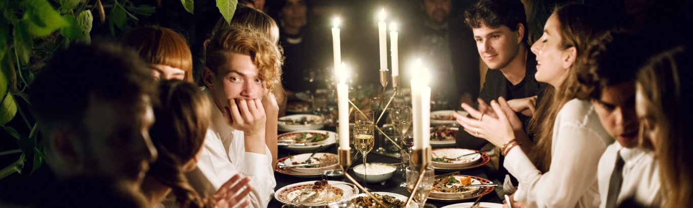 Elegant dinner table at Greenhaus, cozy candlelight for intimate gatherings.