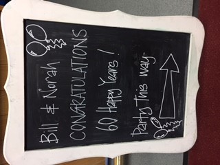 Chalkboard sign for 60th anniversary at Iris Conservatory, Bradbury Fields Garden Suite.