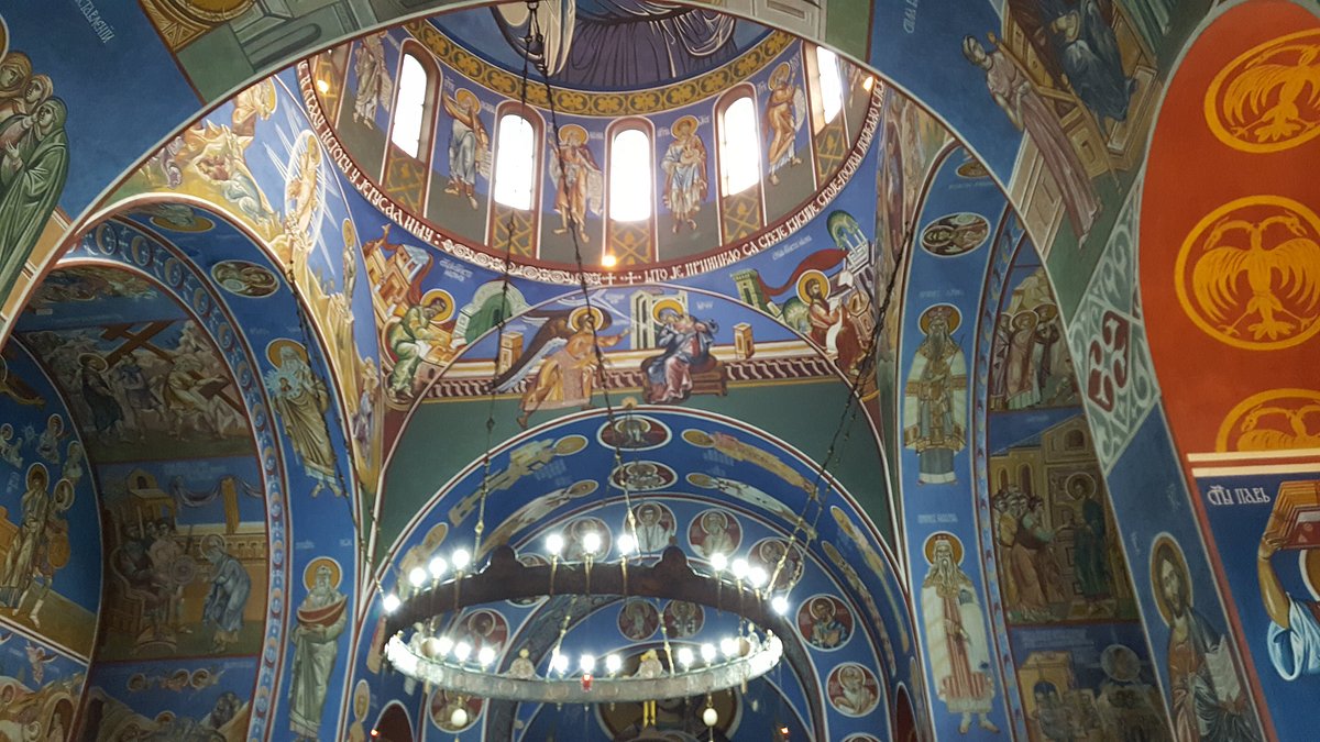 Saint Lazar's Hall interior with vibrant frescoes, ideal for spiritual gatherings and events.