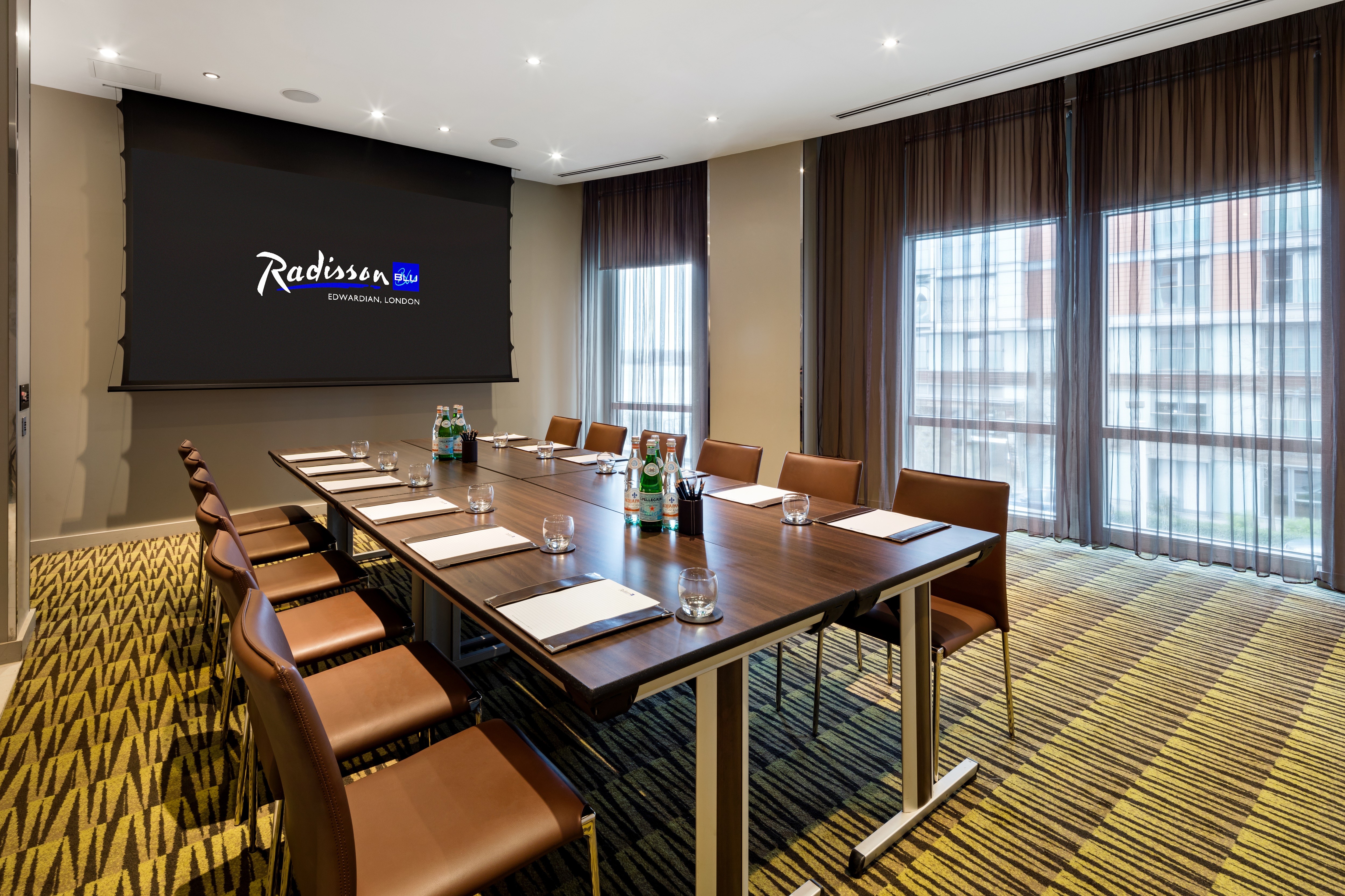 Modern meeting room with conference table at Radisson Blu Edwardian, ideal for events.