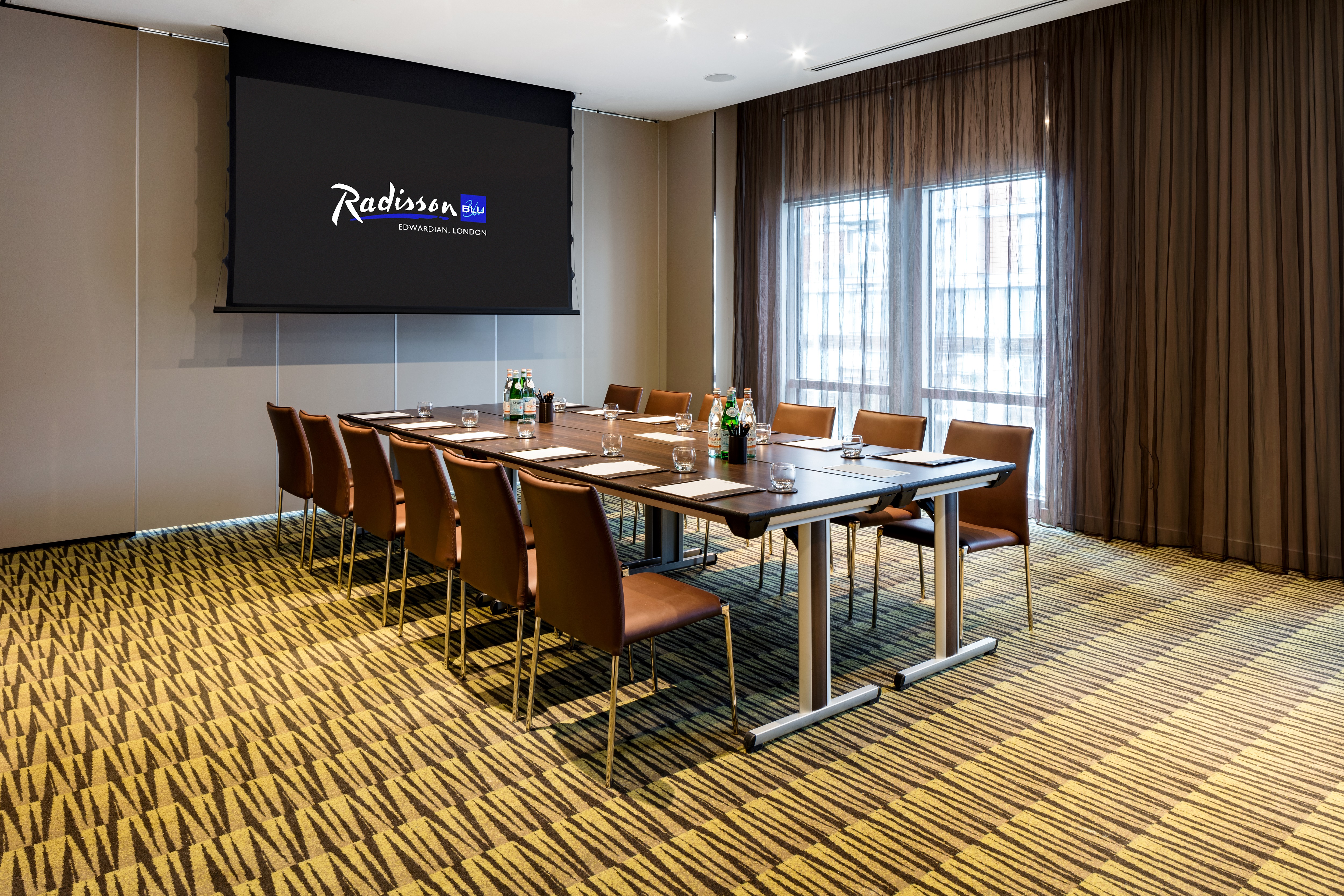 Private Room 2 at Radisson Blu: modern meeting space with large table and natural light.