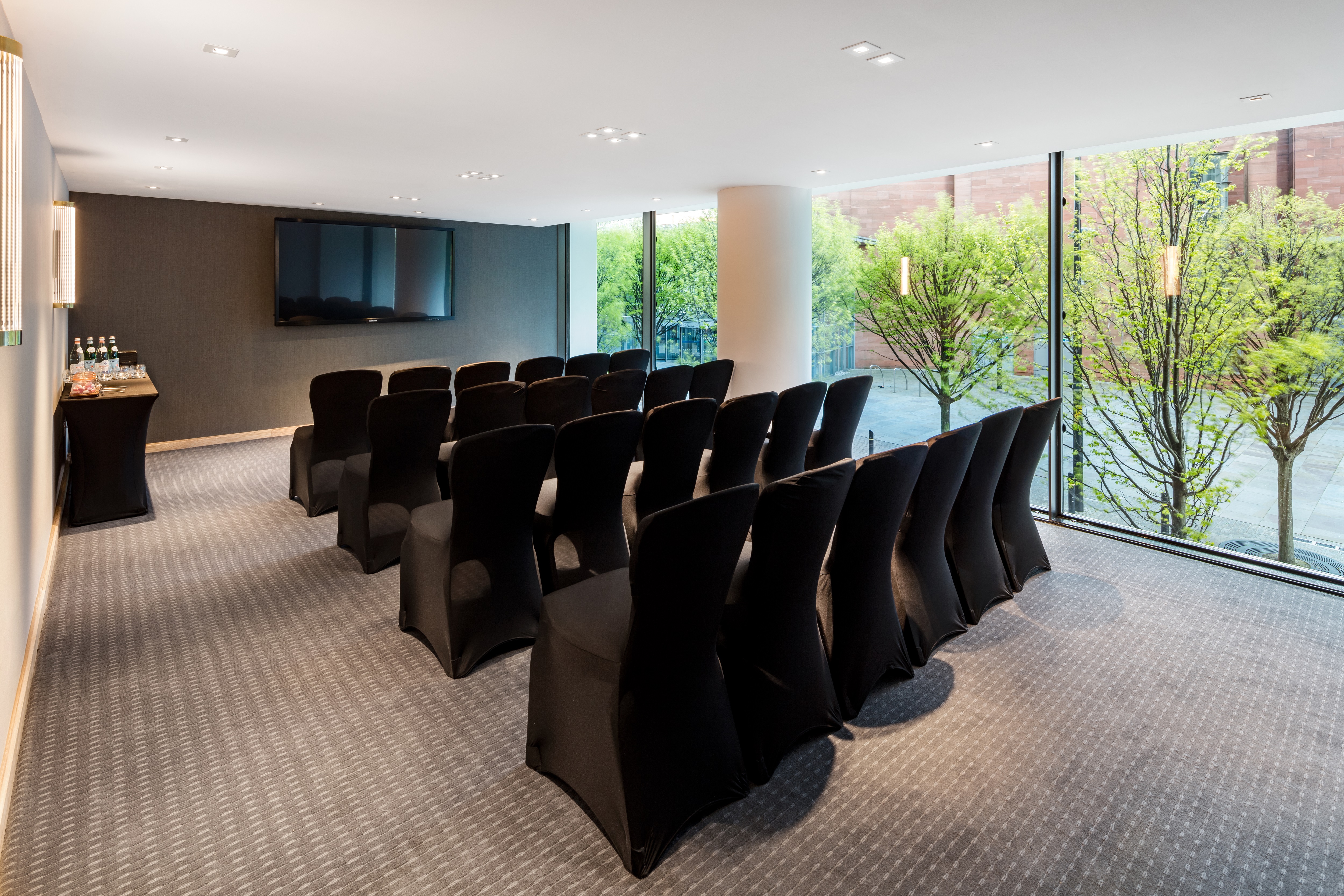 Modern meeting room with sleek chairs, ideal for corporate events and workshops.