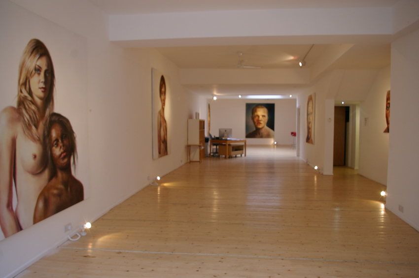 Spacious, well-lit gallery with striking artworks for art exhibitions and corporate events.