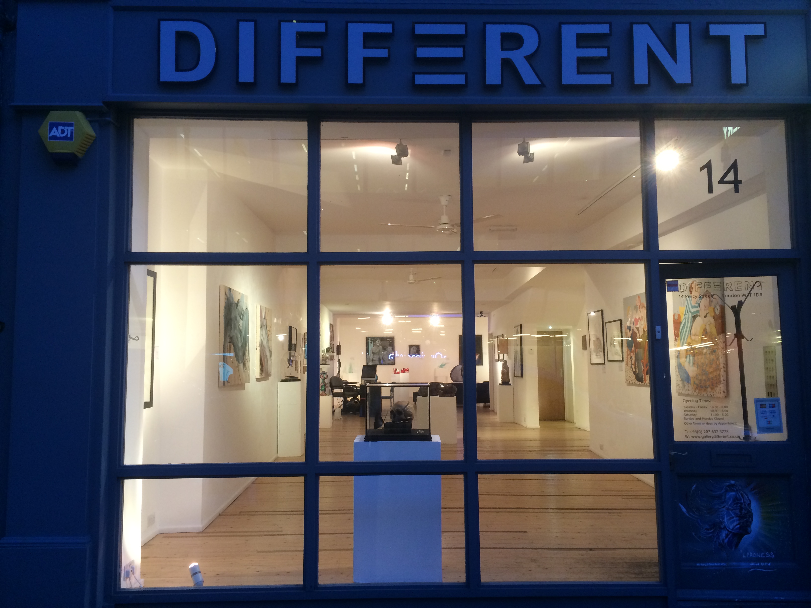 Modern gallery space with large windows, ideal for art exhibitions and corporate events.