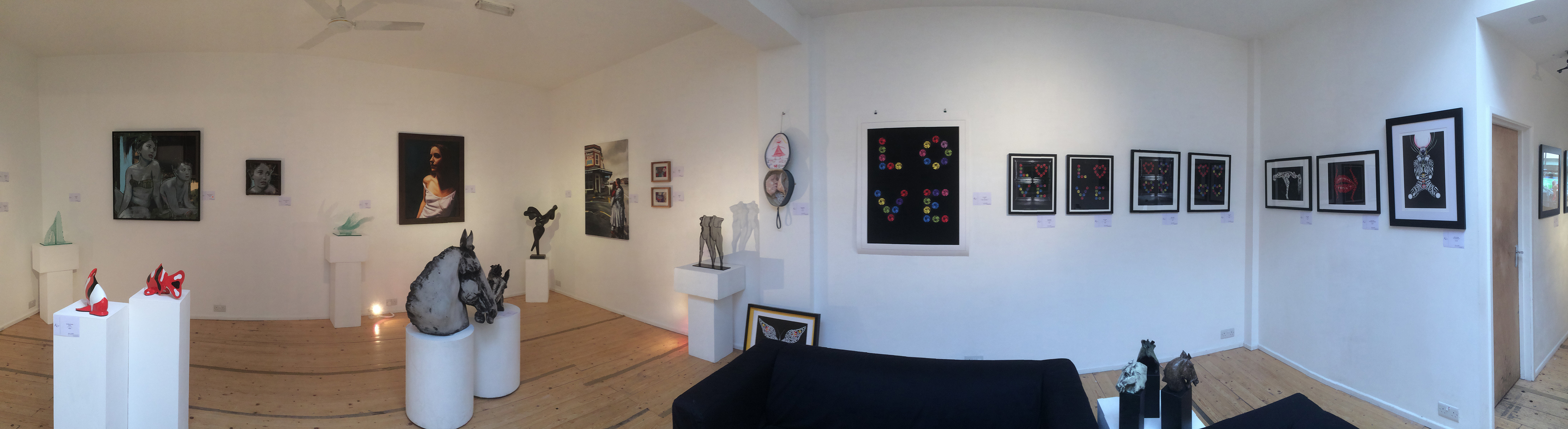 Contemporary art gallery with white walls, perfect for intimate events and exhibitions.