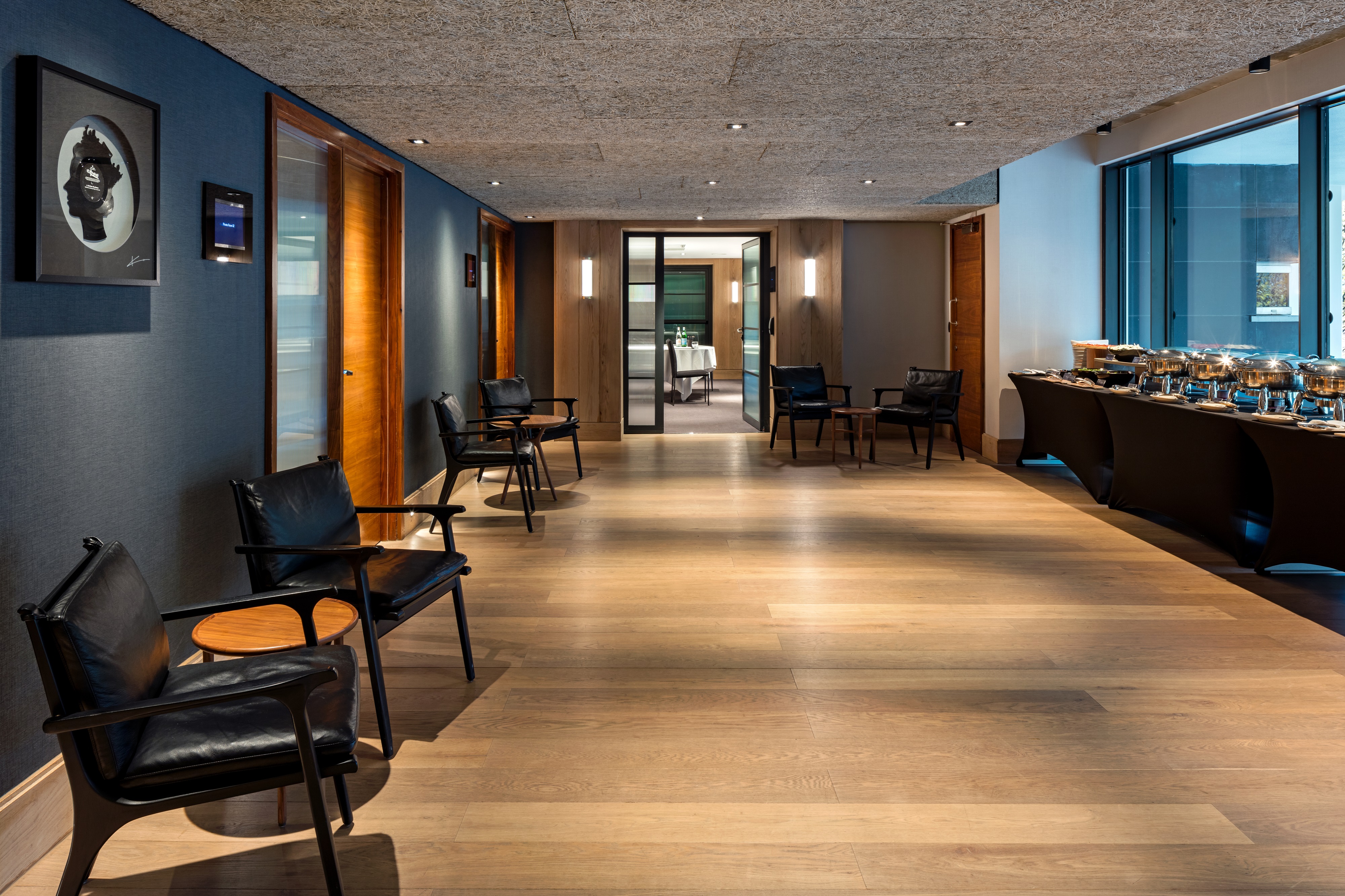 Modern meeting room with buffet setup for networking events at The Edwardian Manchester.