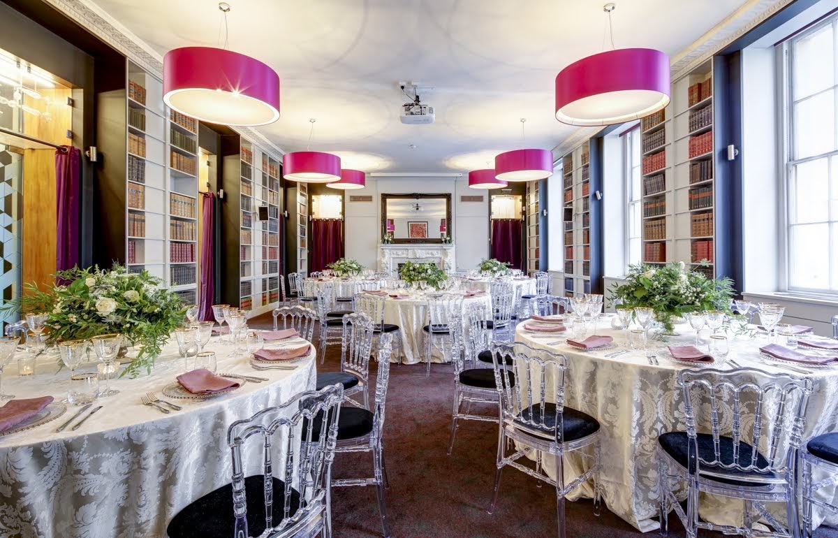 Elegant event space with round tables, ideal for corporate events and weddings.