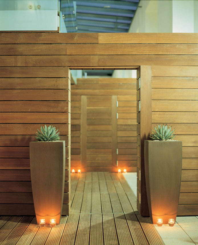 Elegant hotel entrance with wooden panels, ideal for networking events and relaxation.