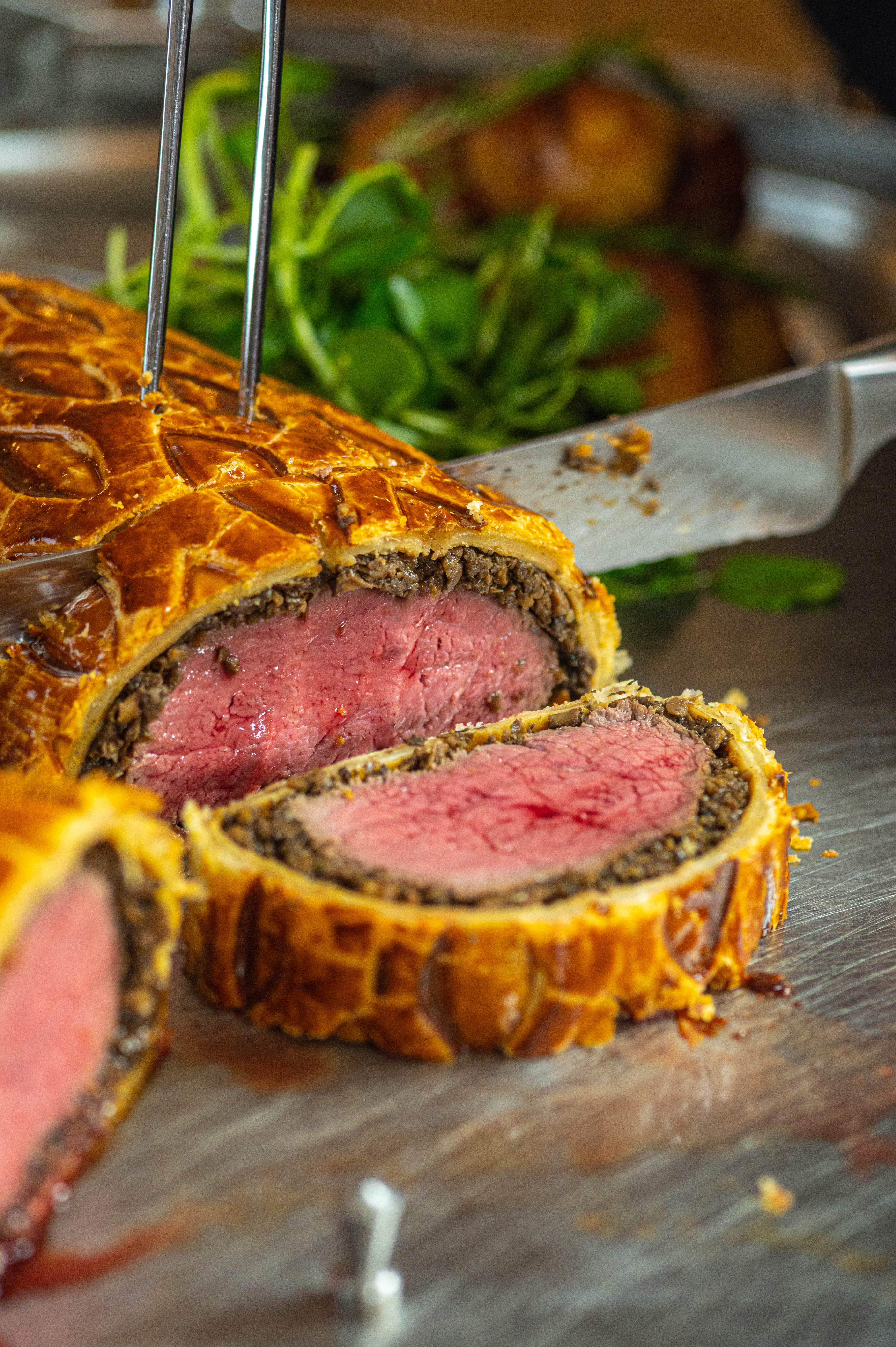 Beef Wellington at The English Grill, upscale catering for events and corporate gatherings.