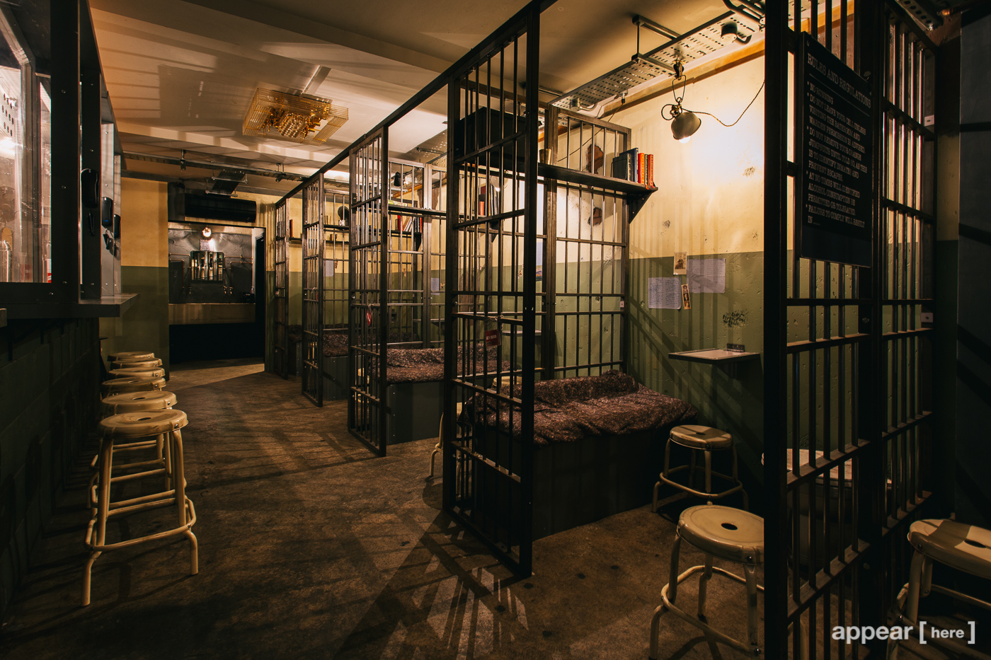 Alcotraz Prison Cocktail Bar with jail cell seating for immersive events and gatherings.