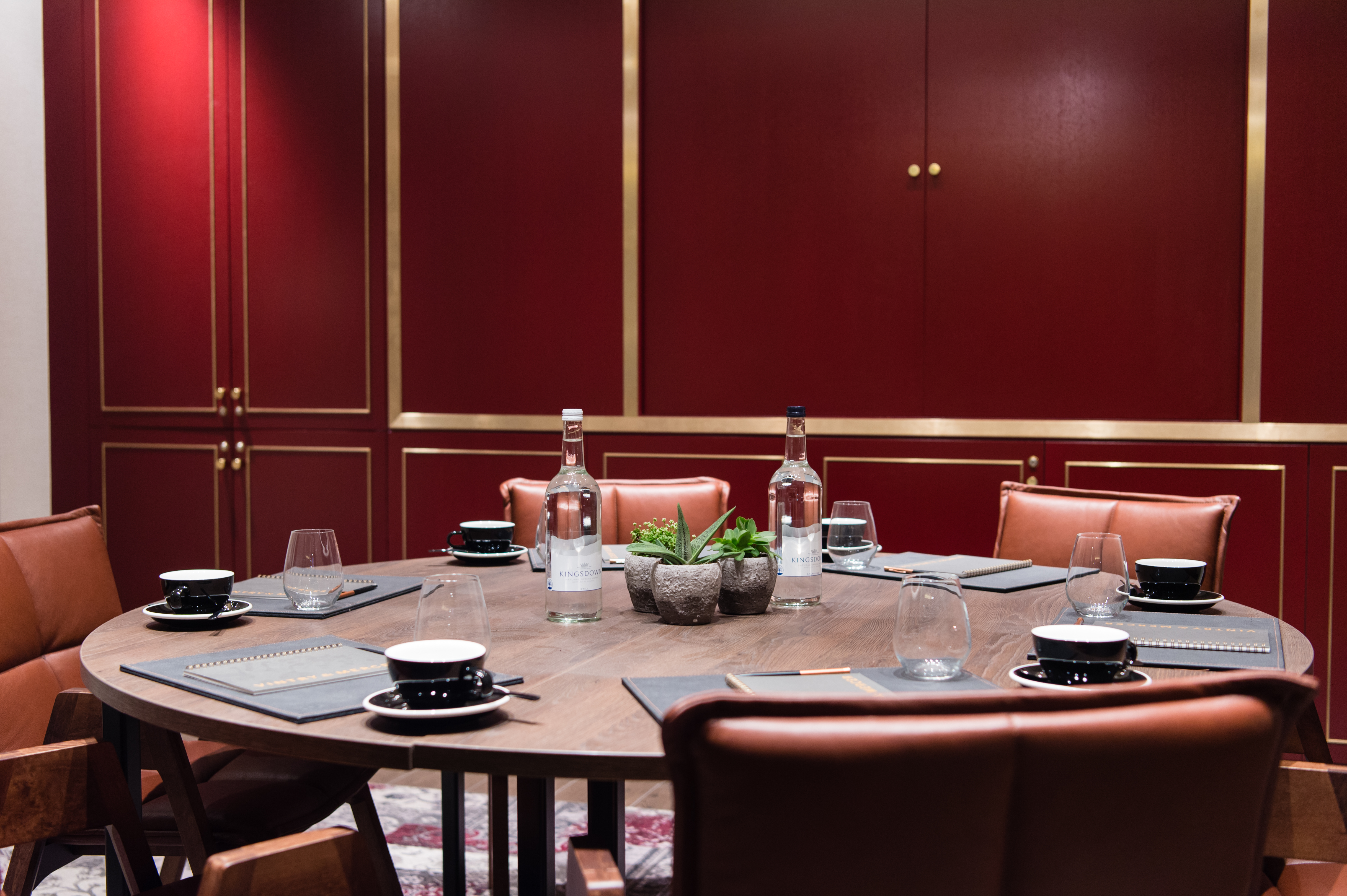 Sophisticated meeting room with round table at Vintry and Mercer Hotel for exclusive events.