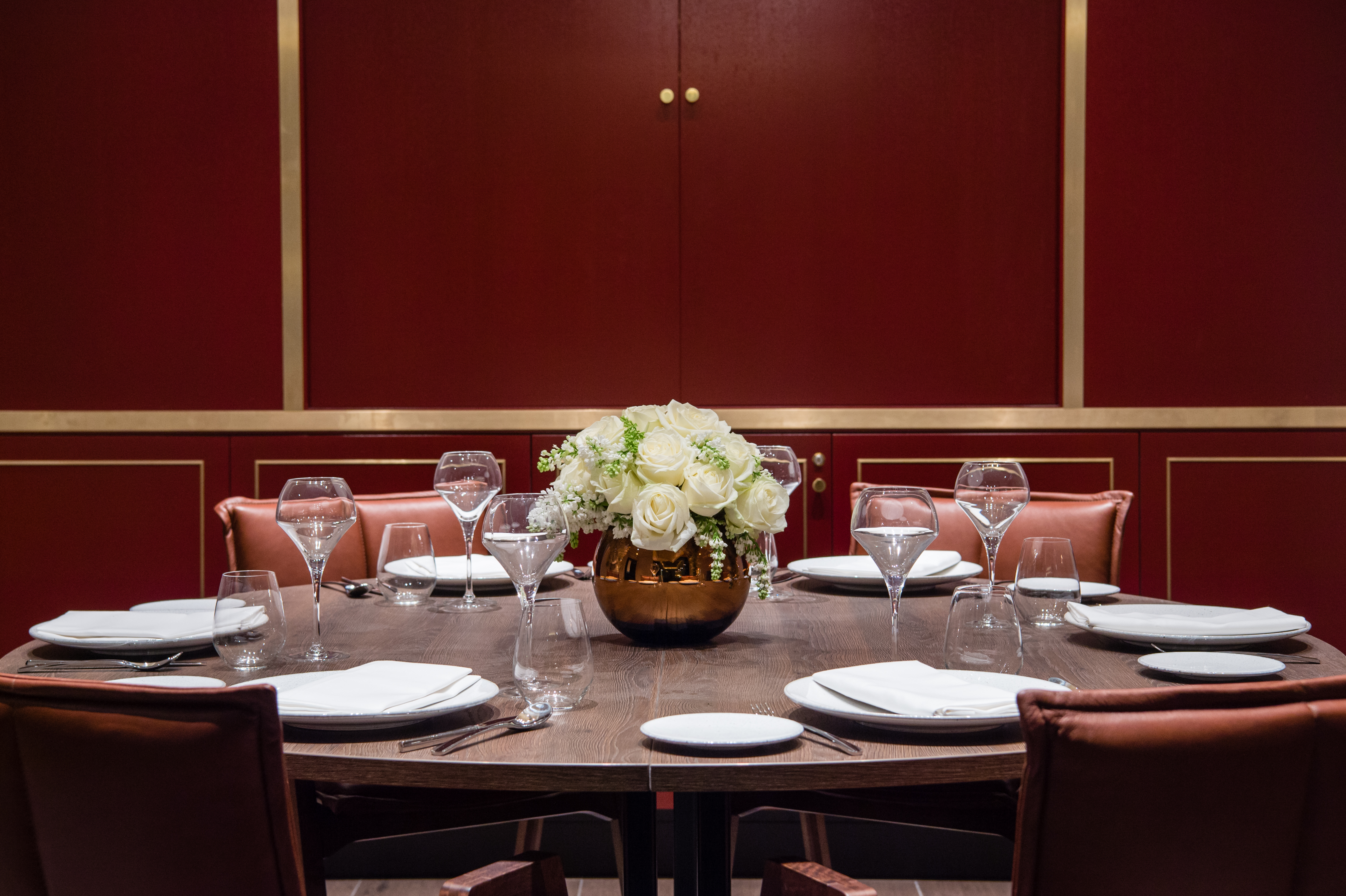 Elegant dining table with floral centerpiece at Vintry and Mercer Hotel event space.