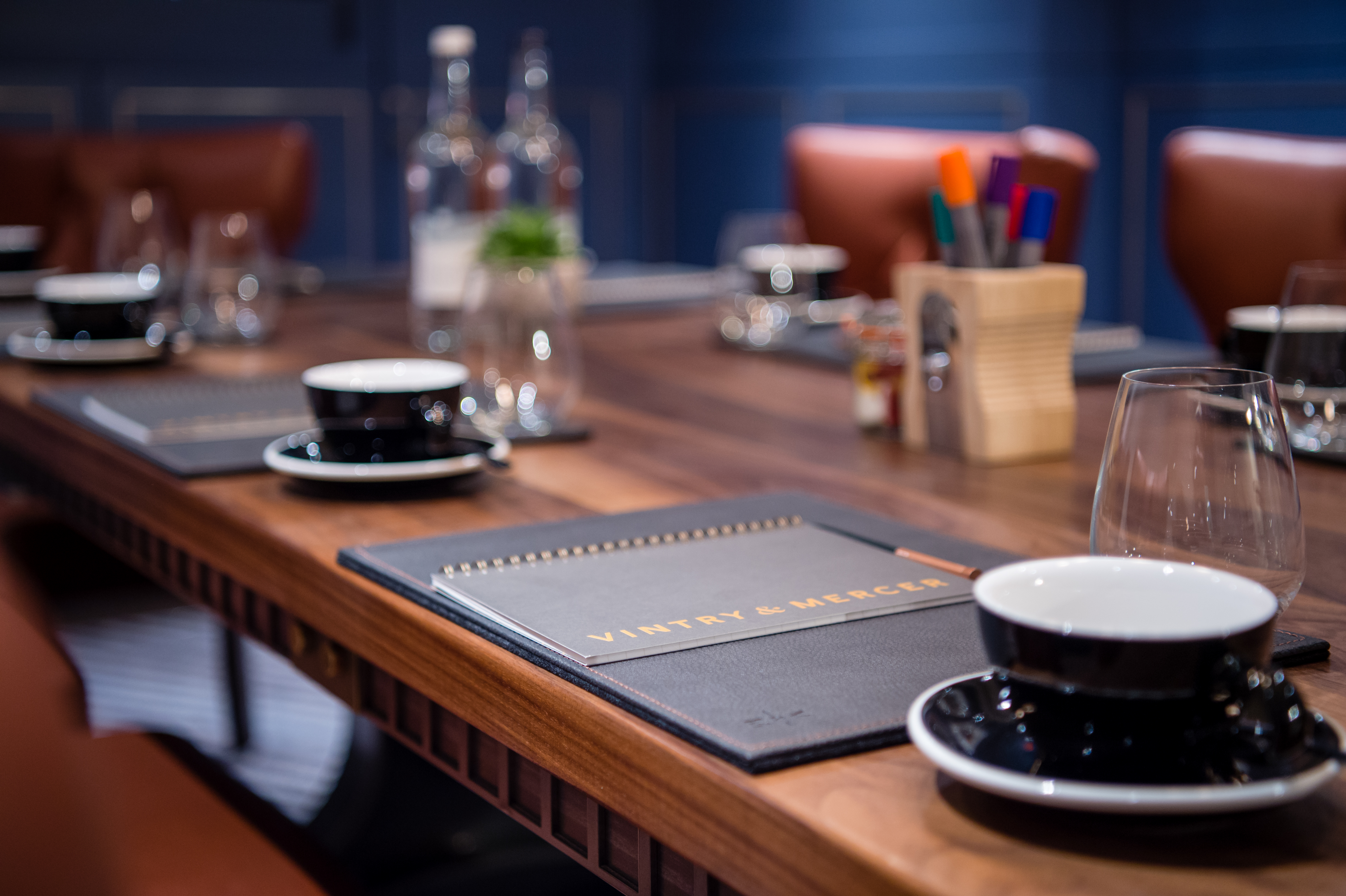 Elegant meeting room at Vintry and Mercer Hotel with polished wooden table for professional events.
