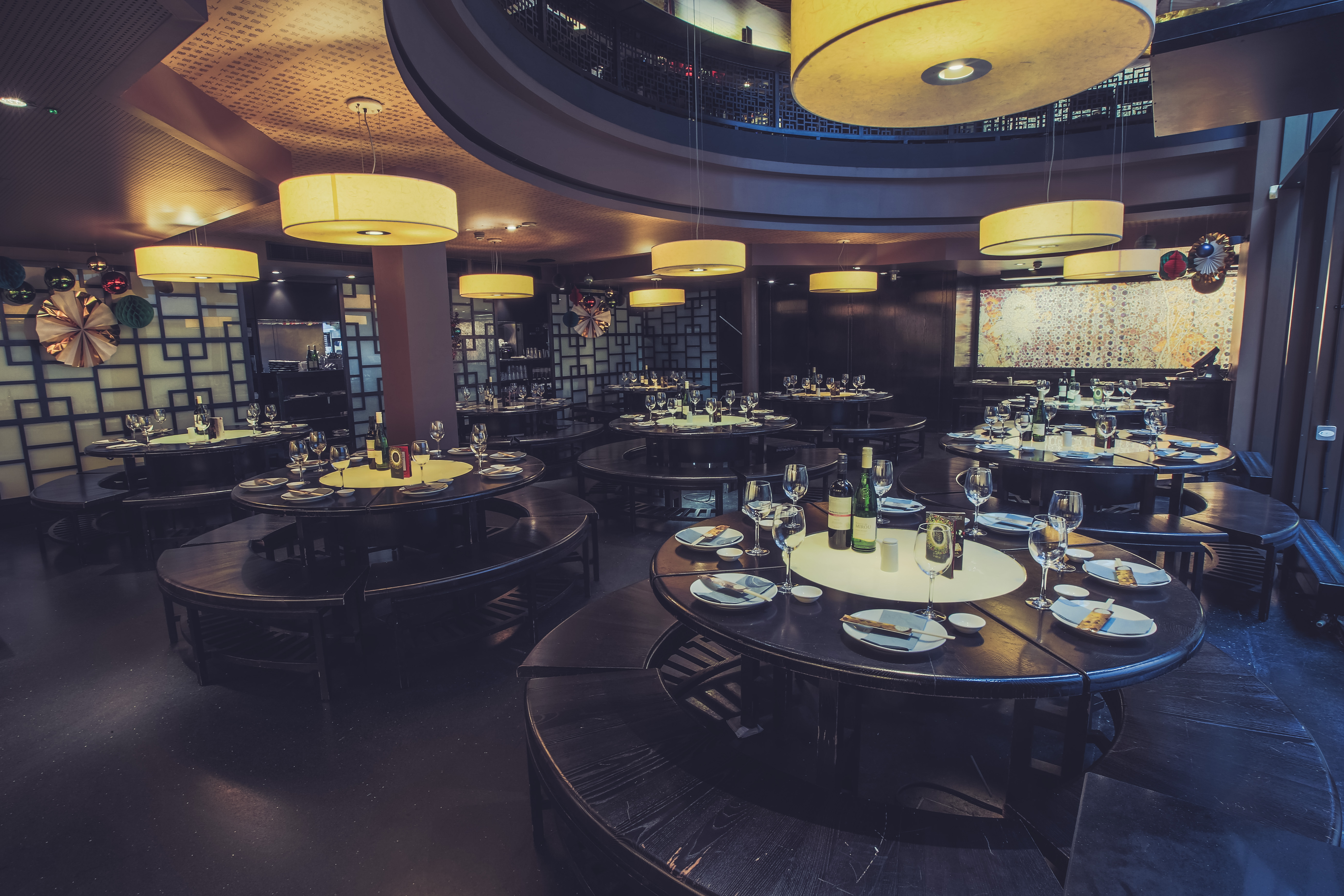 Sophisticated dining space for corporate events at Ping Pong Soho with round tables.