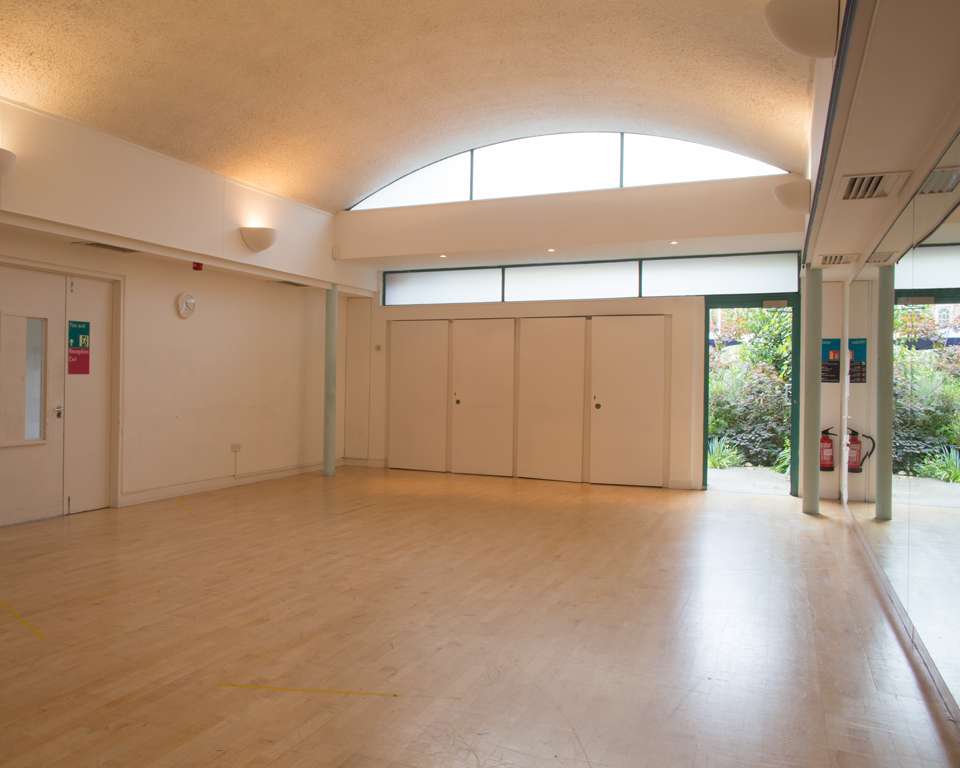 Versatile event space with natural light for meetings and workshops at Clean Break Studios.