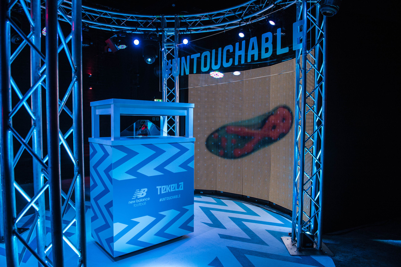 Eclipse Theatre: vibrant event space with multimedia backdrop for product launches.