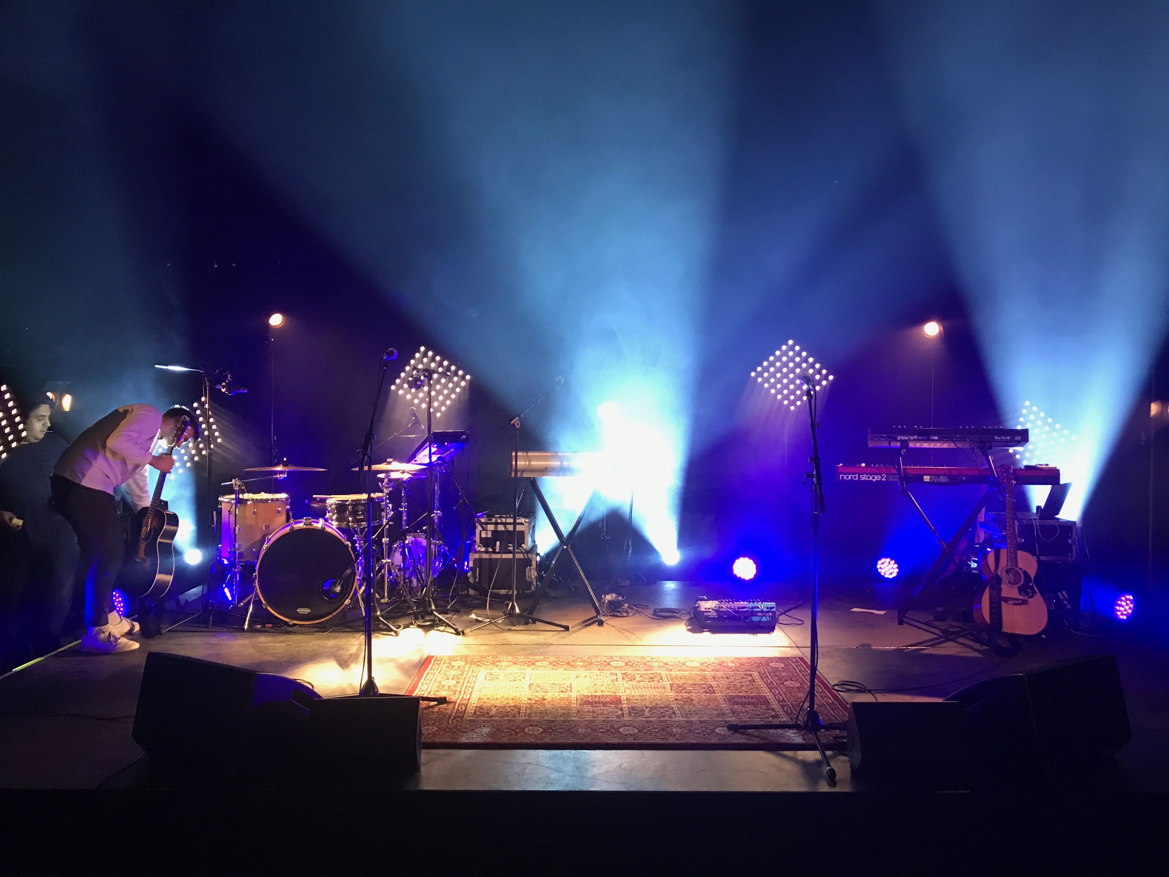 Eclipse Theatre stage setup with illuminated elements for a live performance event.