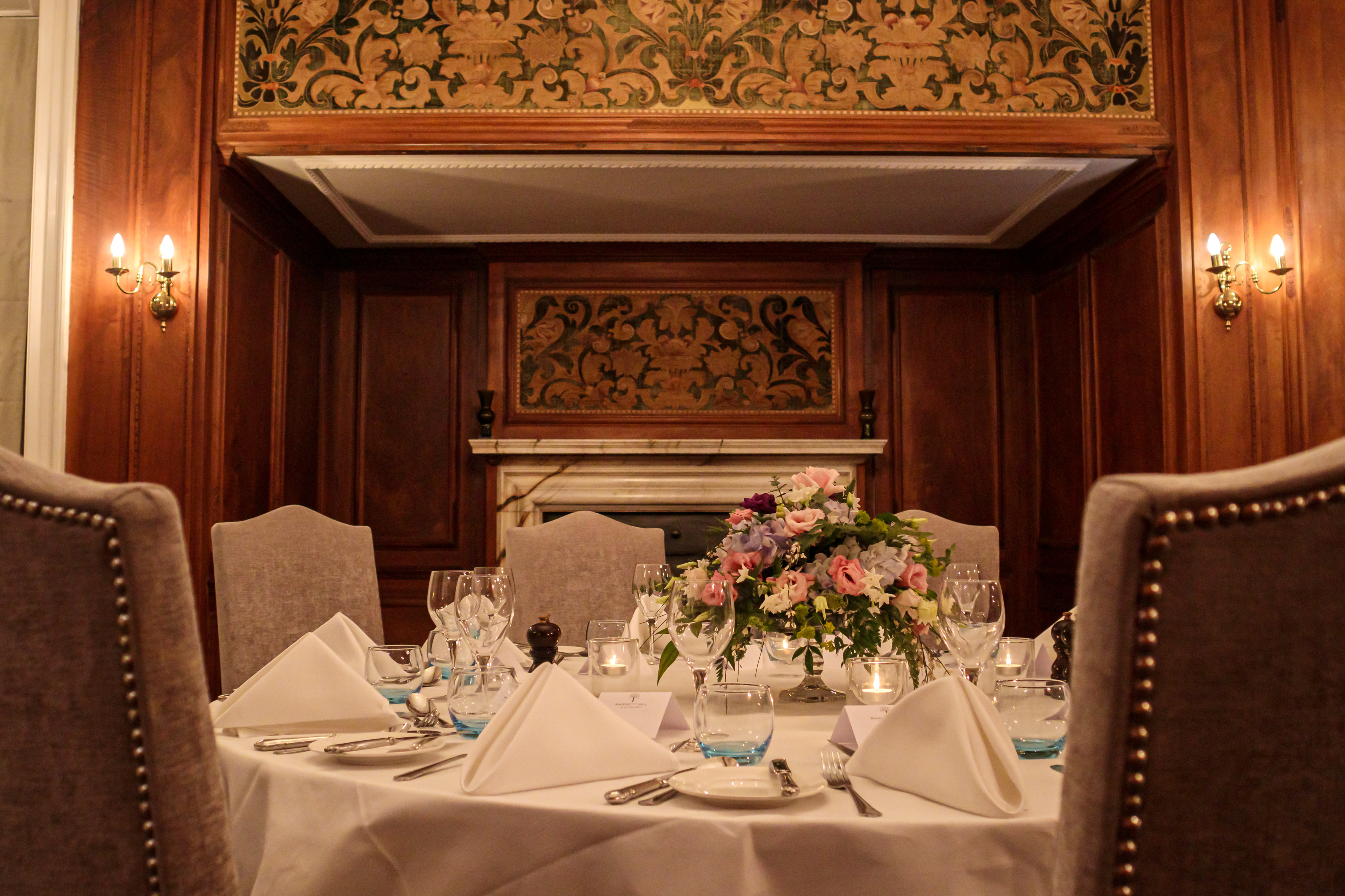 Elegant dining table with floral centerpiece at Barnett Hill Hotel for corporate events.