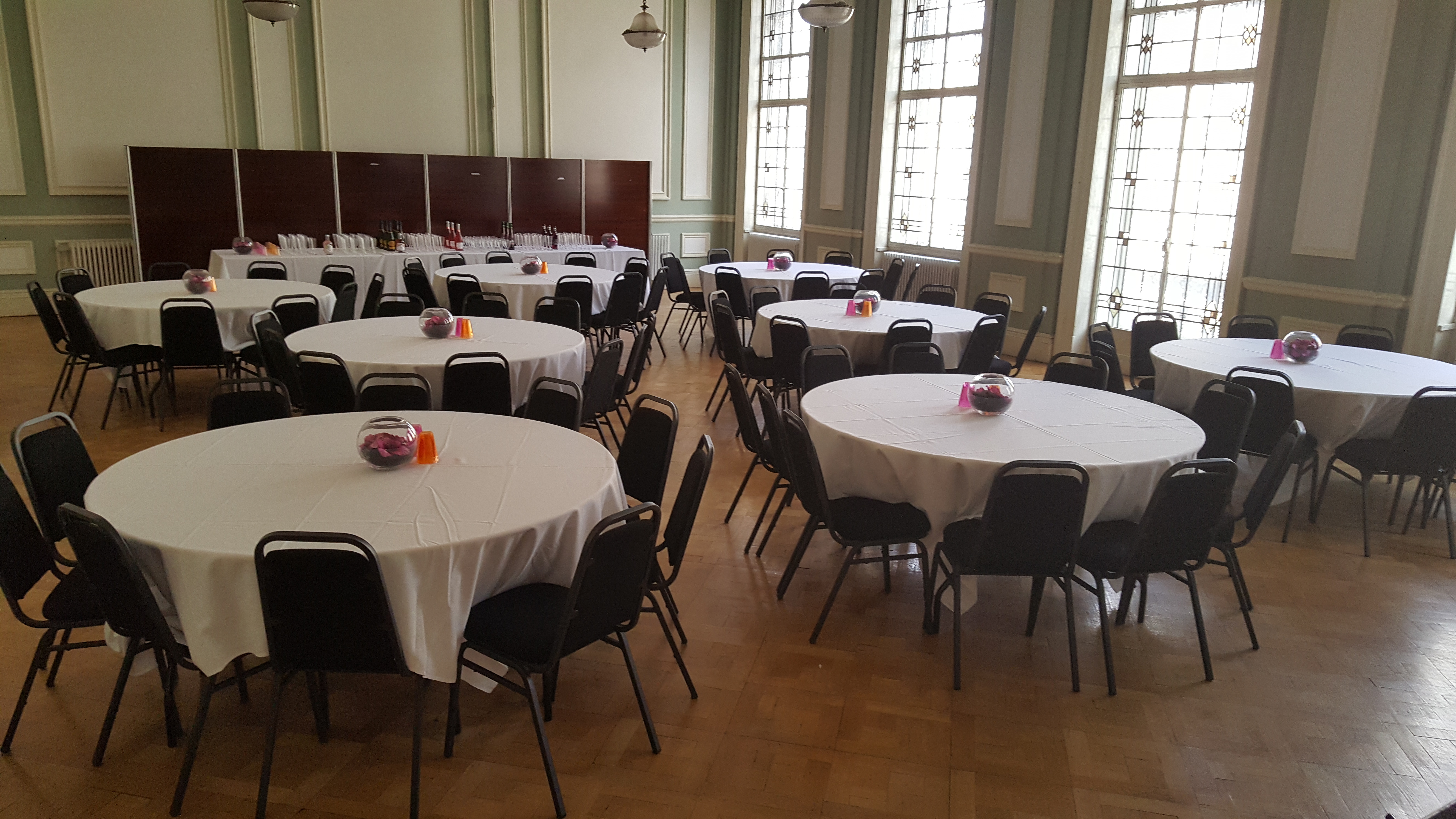 Chamber Hall event space with round tables, ideal for conferences and banquets.