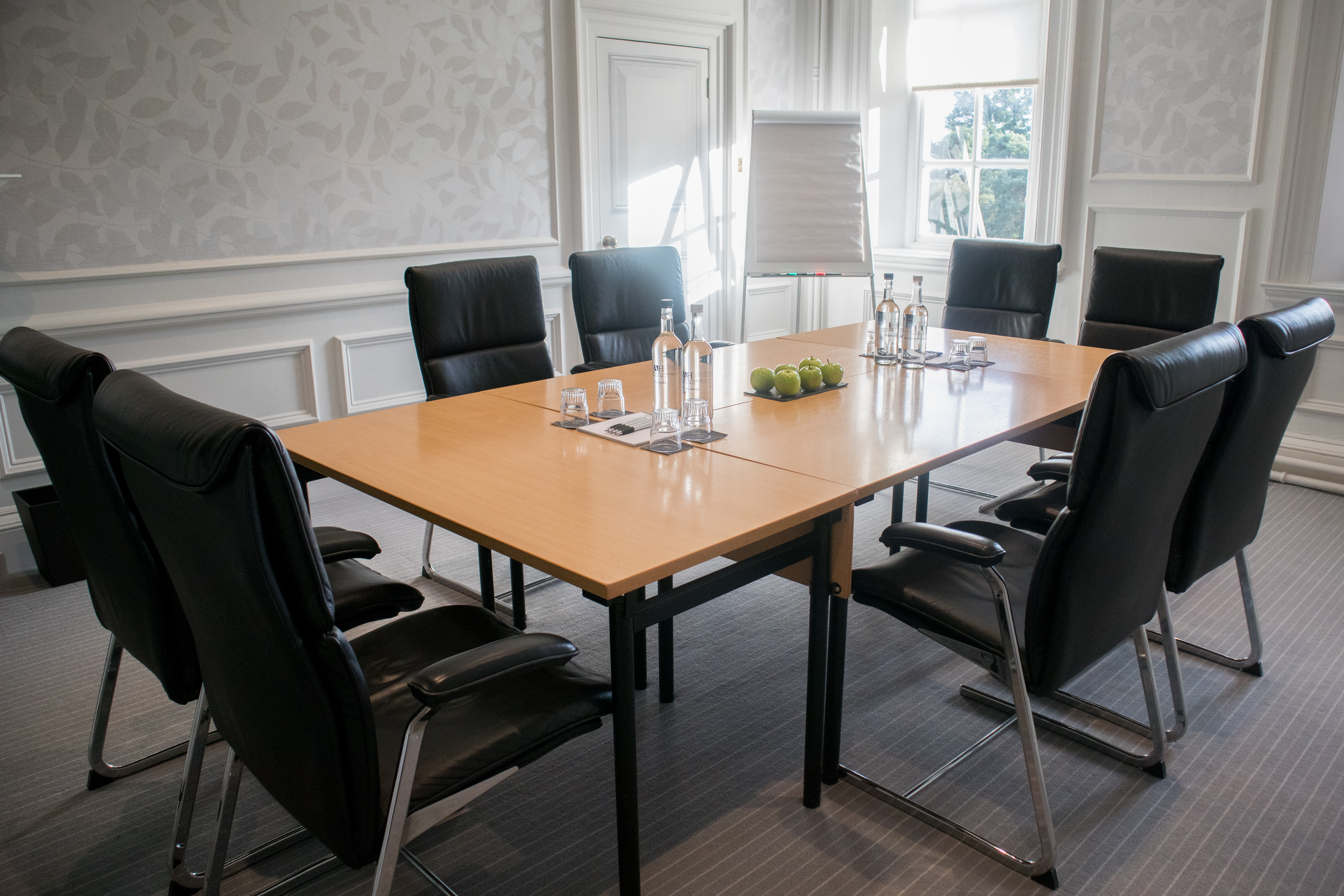 Acer meeting room at Barnett Hill Hotel with polished table and natural light.