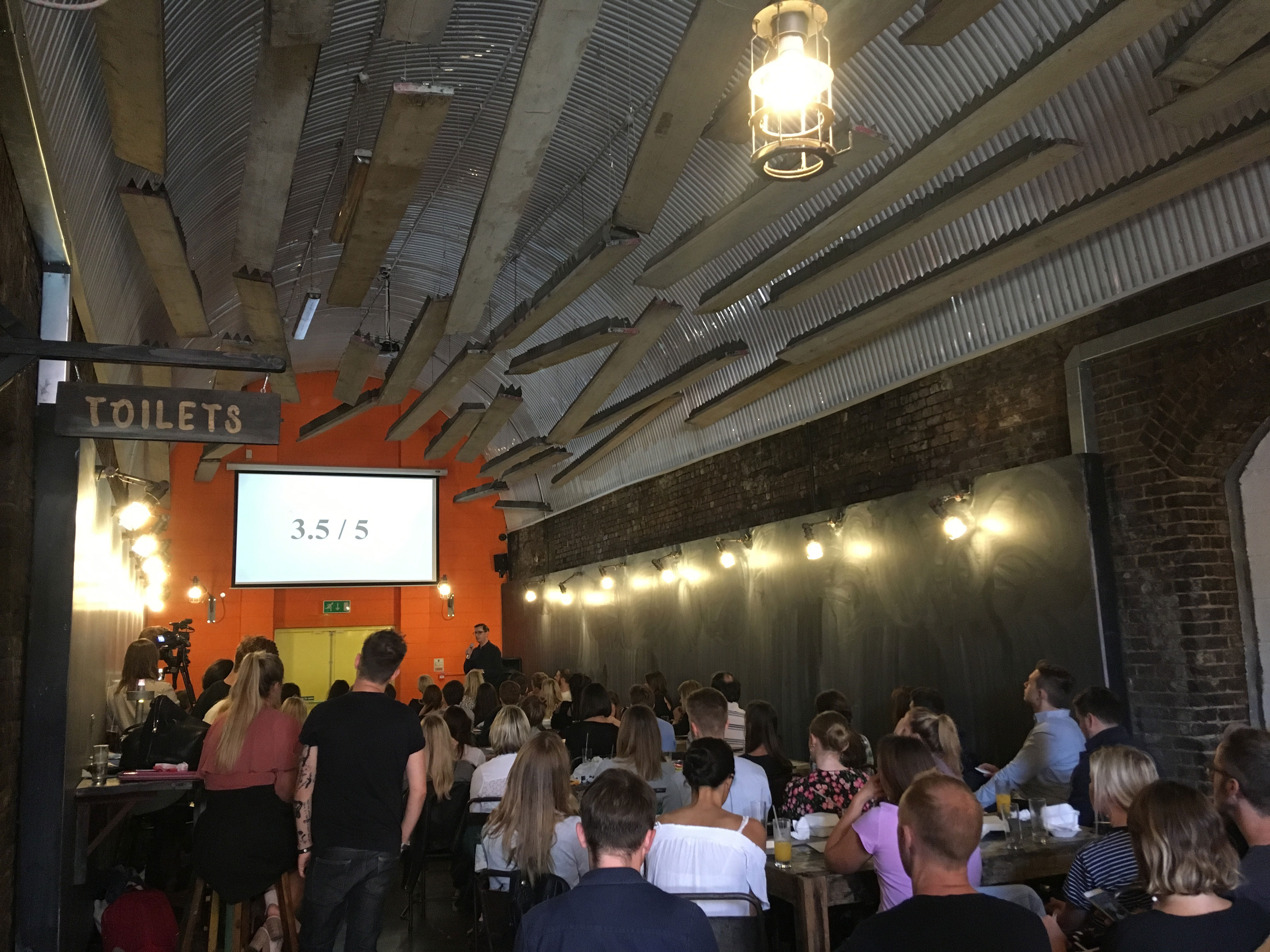 Engaged audience in modern Doodle Bar, ideal for workshops and seminars.