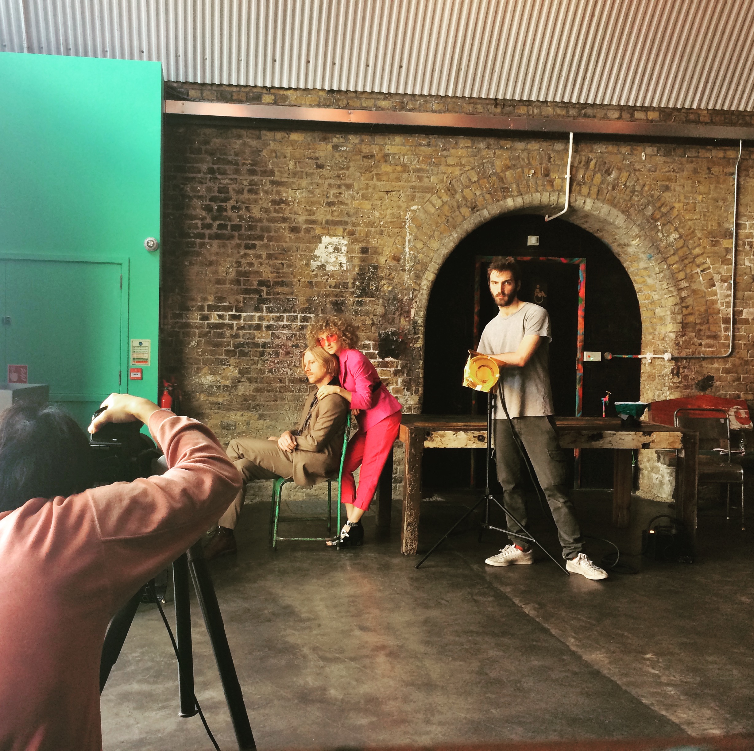 Creative photoshoot setup at The Doodle Bar, featuring an industrial backdrop for events.