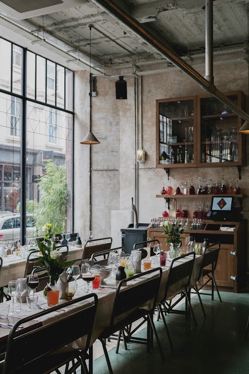 Stylish Bitters Bar event space with large windows, ideal for networking and workshops.