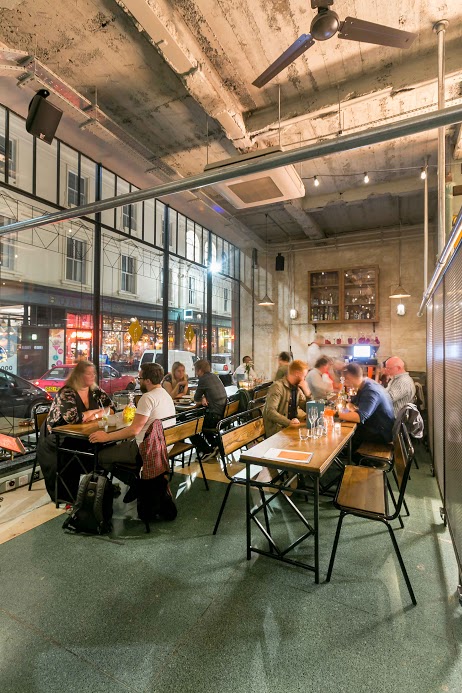 Vibrant Bitters Bar in Canova Hall, ideal for casual meetings and social events.