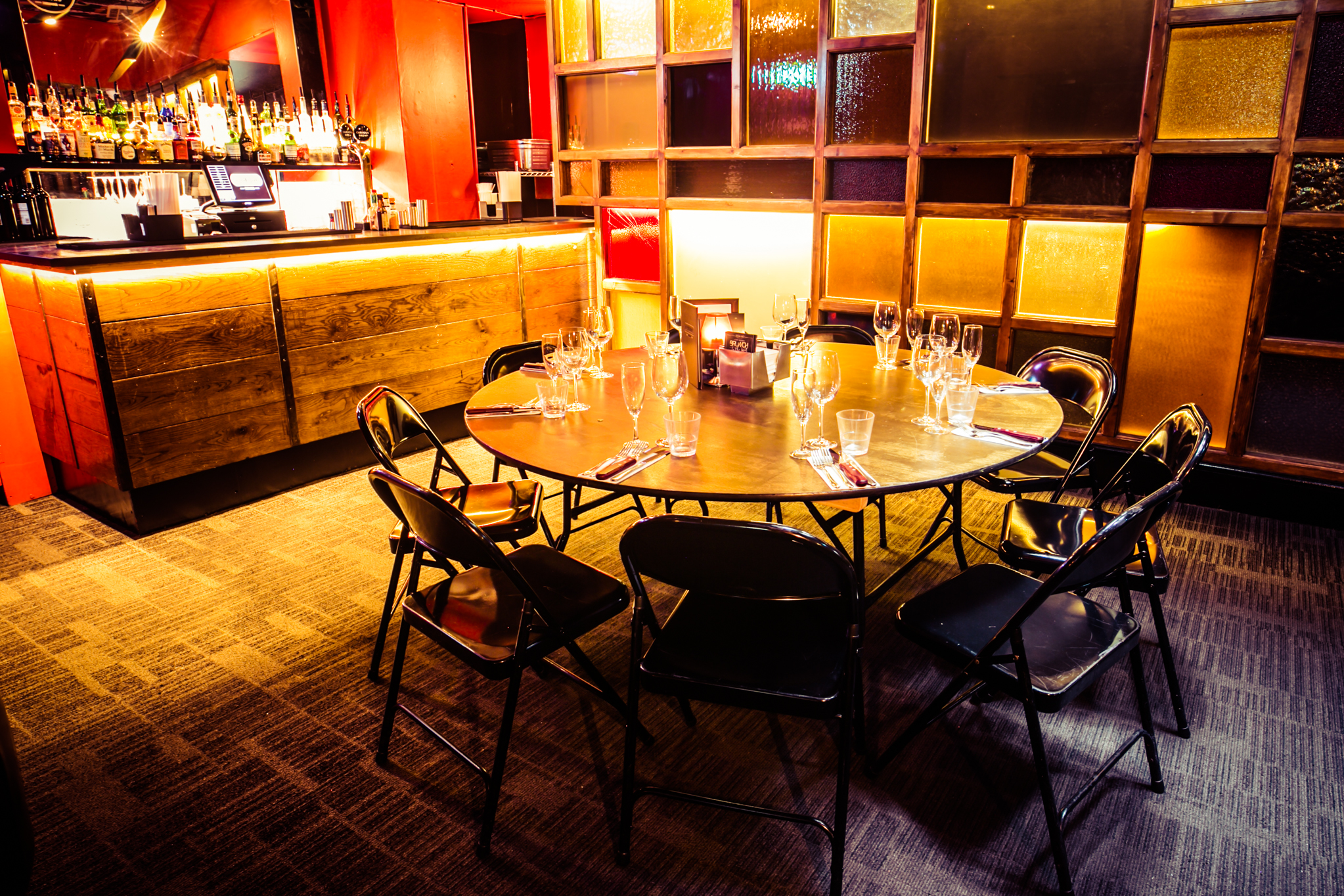 Intimate round table meeting space at The Party Bar, ideal for networking events.