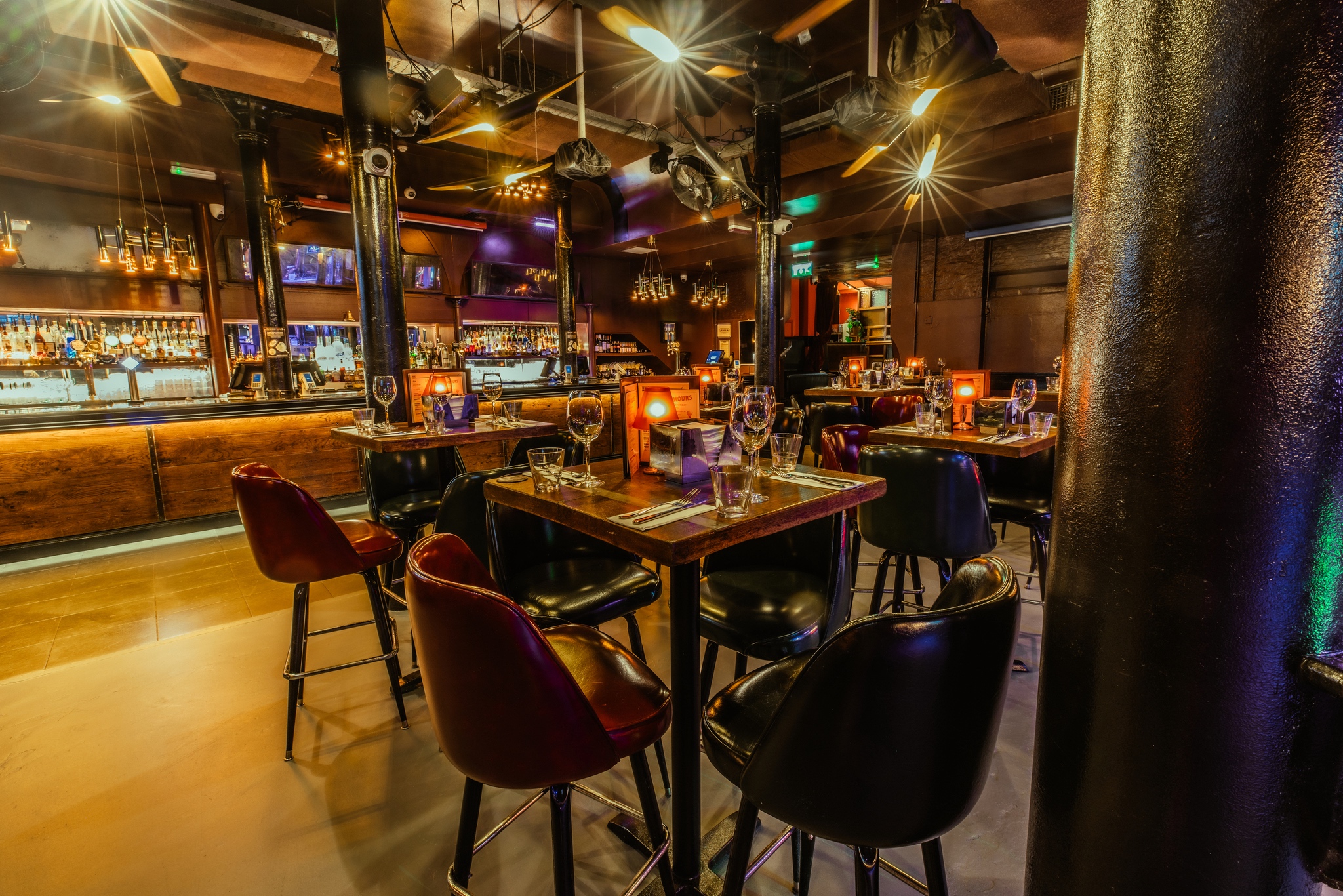 Stylish restaurant venue with warm lighting for corporate events and gatherings.