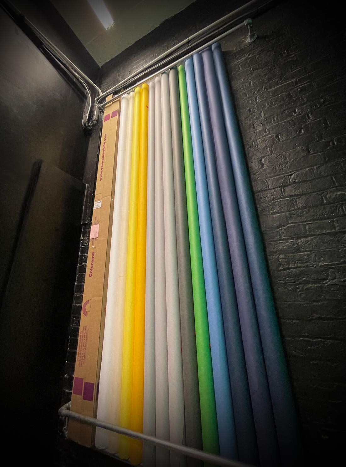 Vibrant backdrop rolls in Crixus Studio for events and photo ops.