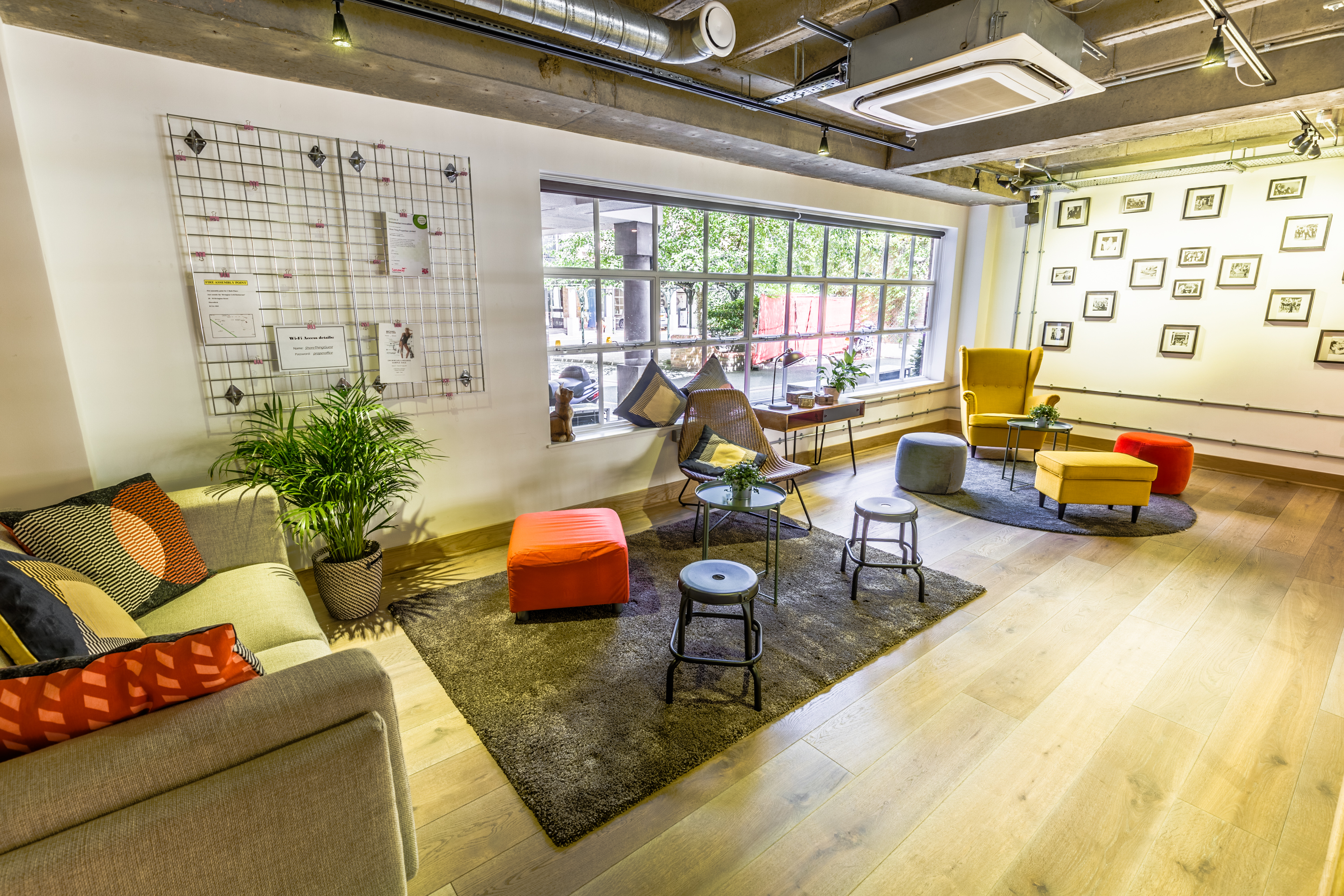 Cozy meeting space with colorful chairs, perfect for workshops and team collaboration.
