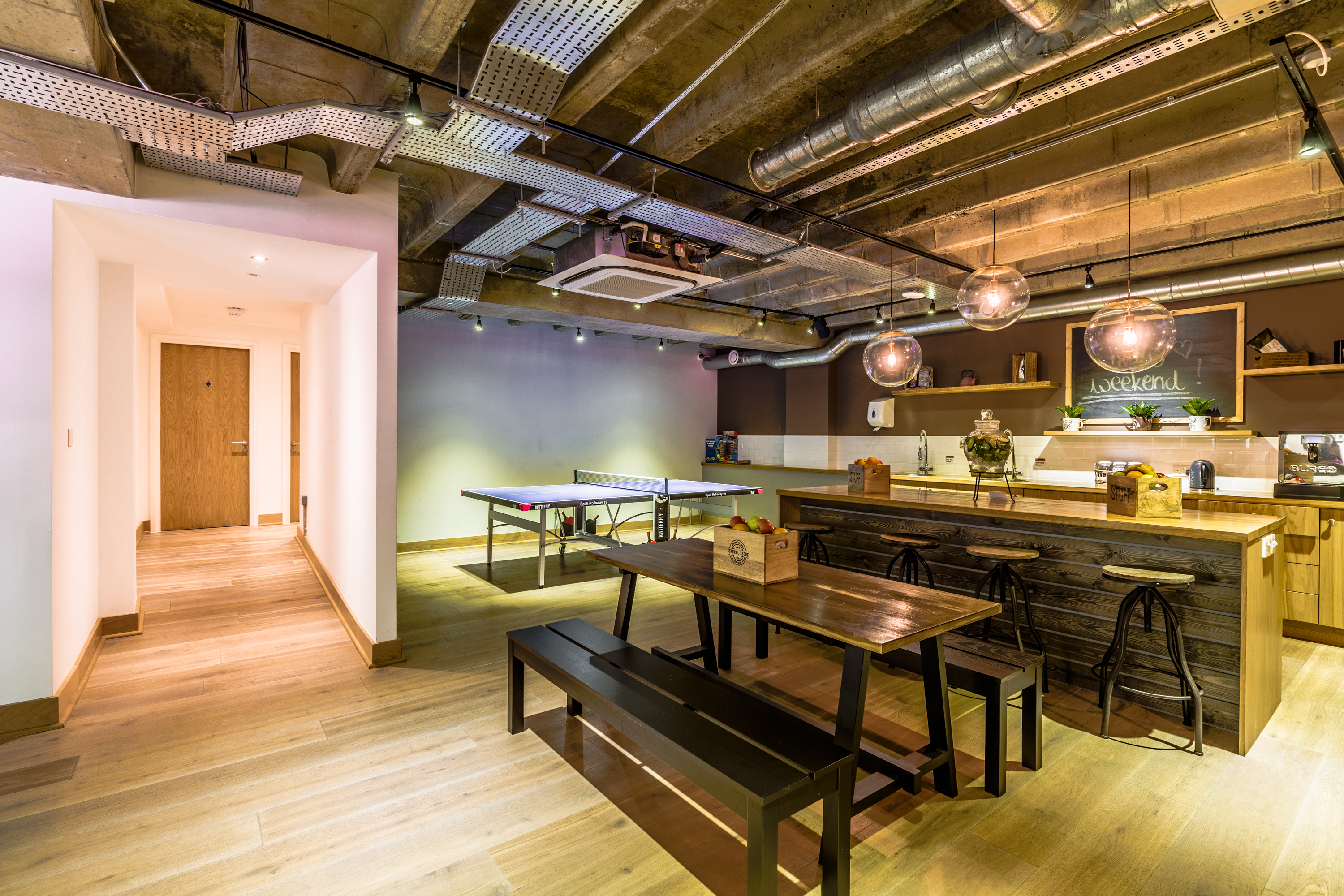 Modern meeting space at Cafe Venue with warm lighting for casual gatherings.