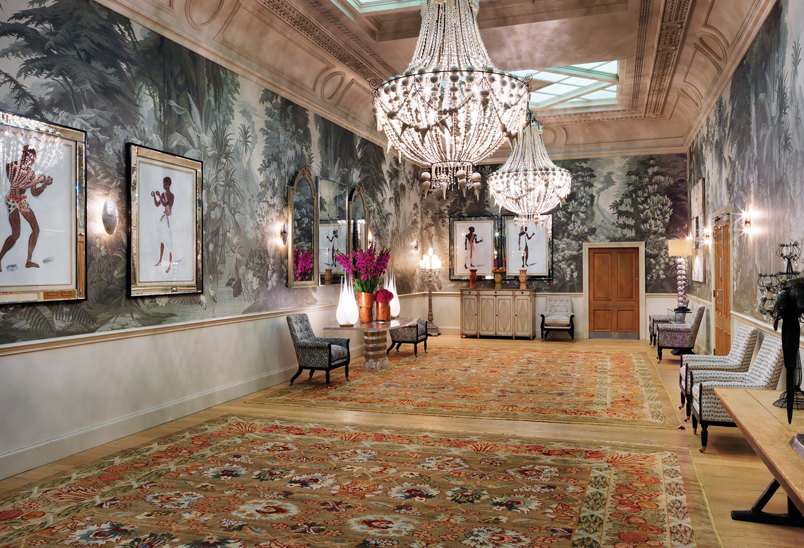 Elegant foyer with chandeliers at Haymarket Hotel for upscale receptions and networking events.