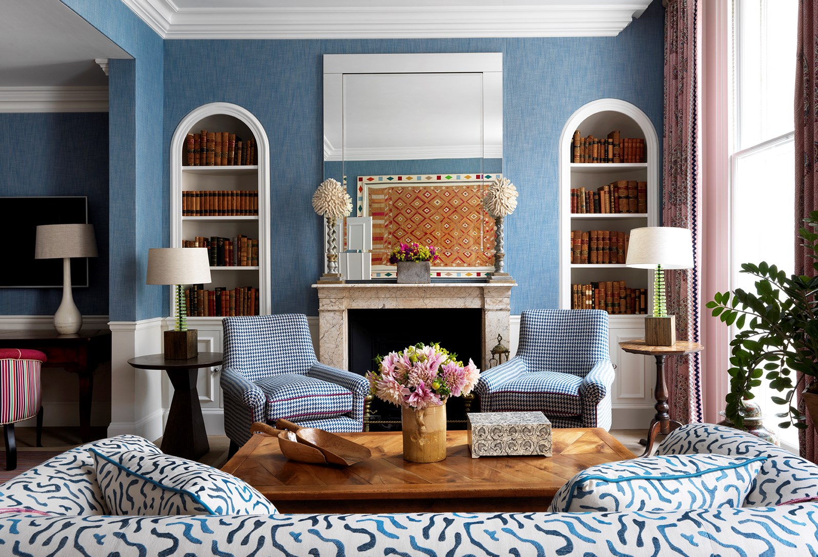 Stylish meeting space at Haymarket Hotel with blue walls, ideal for networking events.