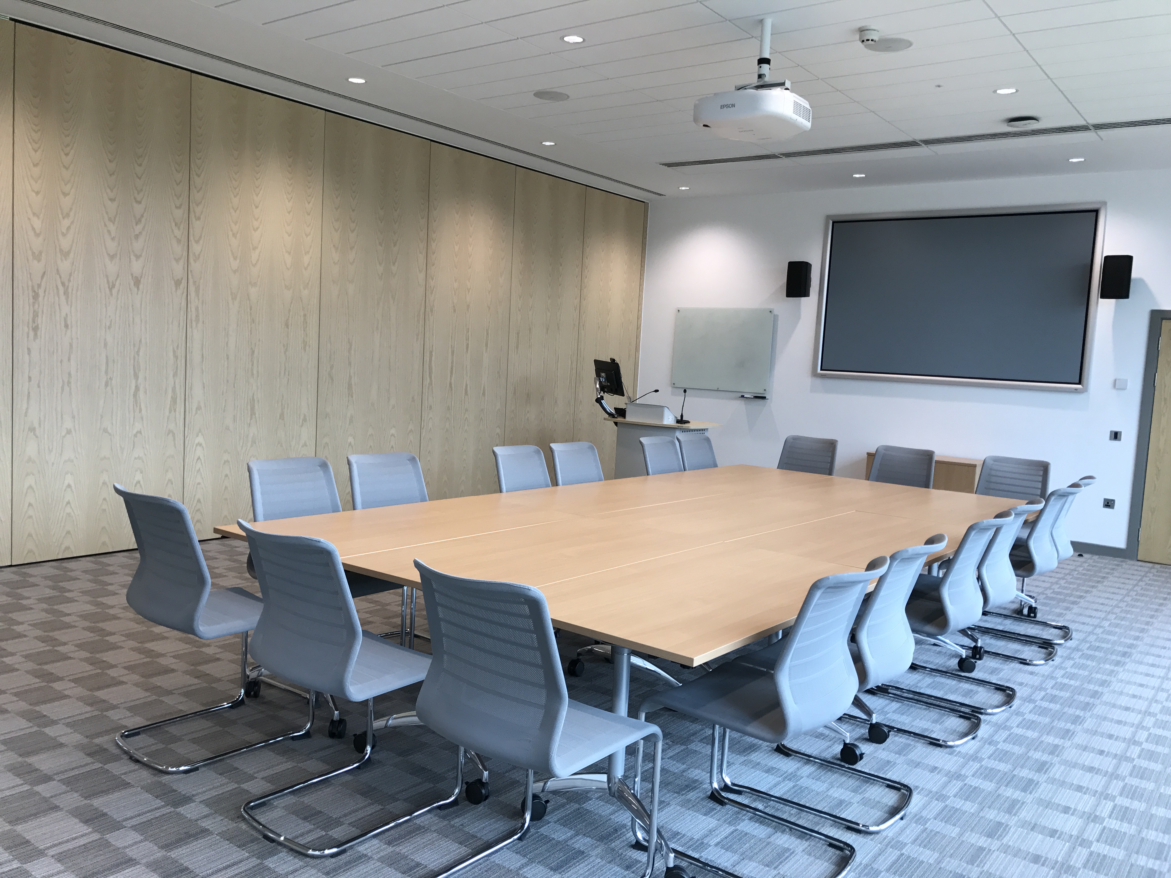 Modern conference room in King's Hedges, Cambridge, with ergonomic chairs for meetings.
