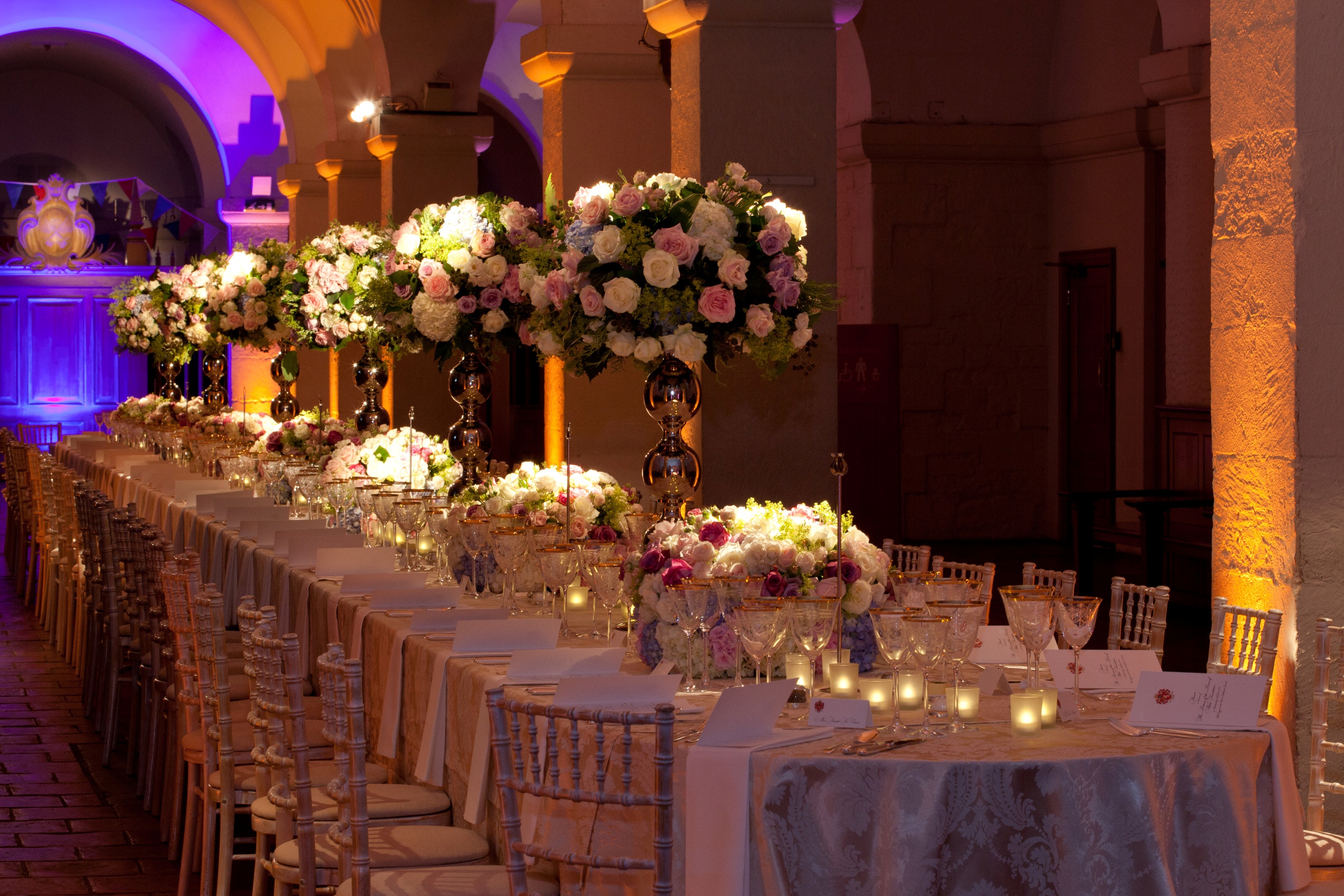 Elegant banquet table with floral centerpieces in St. Paul's Cathedral for weddings or events.