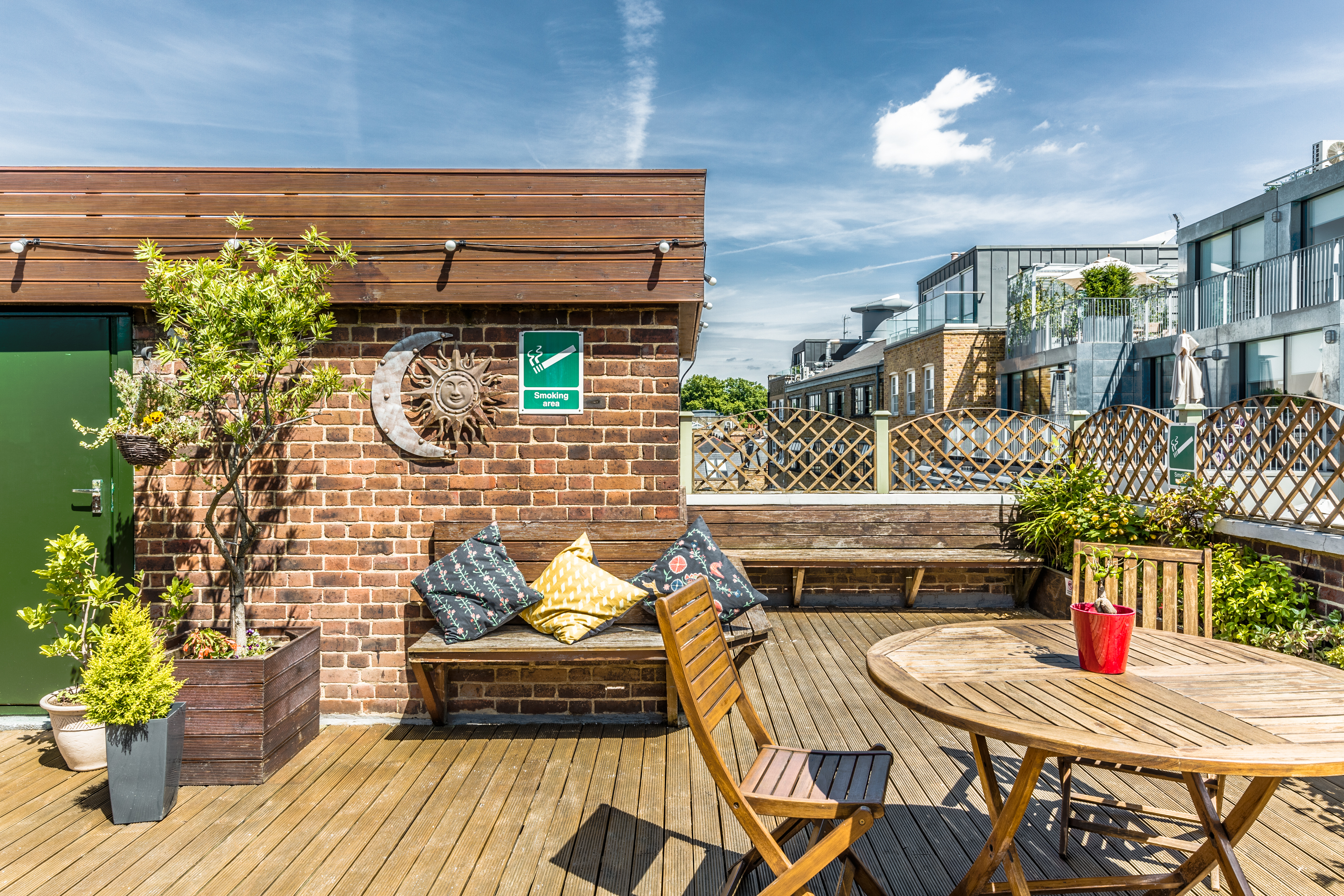 Stylish rooftop venue with greenery, ideal for summer networking events and meetings.