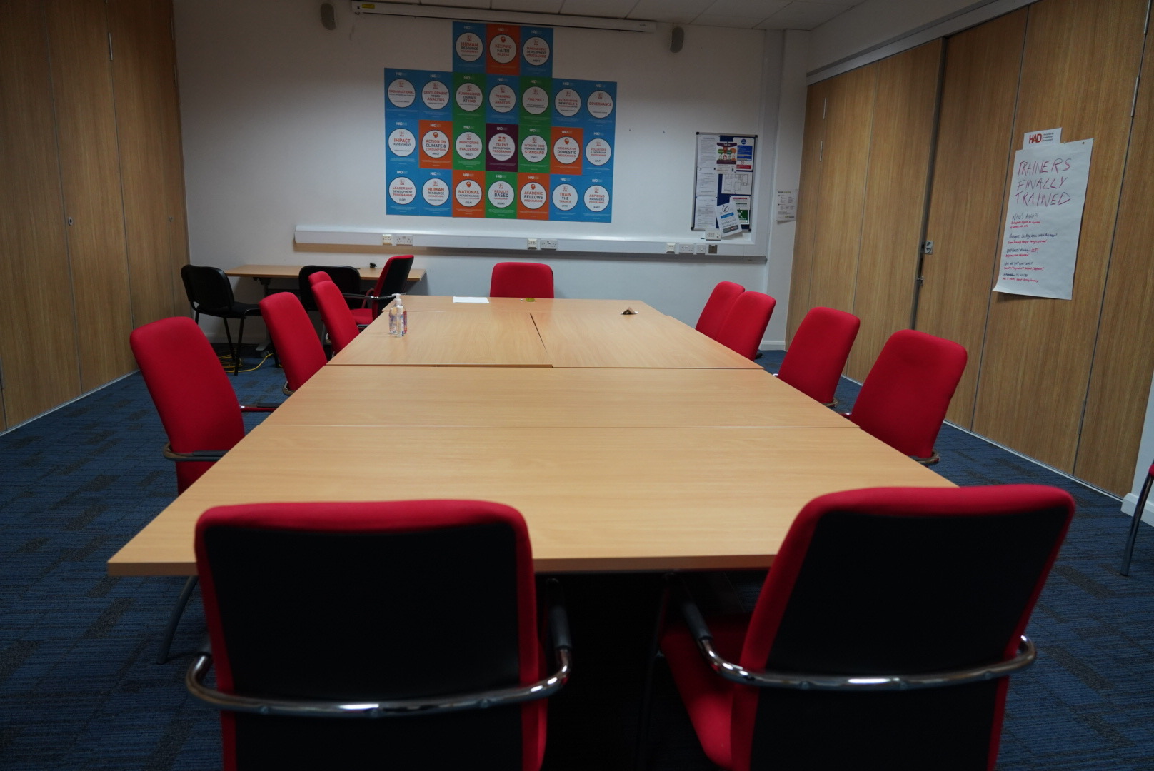 Meeting room 2 at HAD with red chairs, ideal for collaborative meetings and brainstorming.
