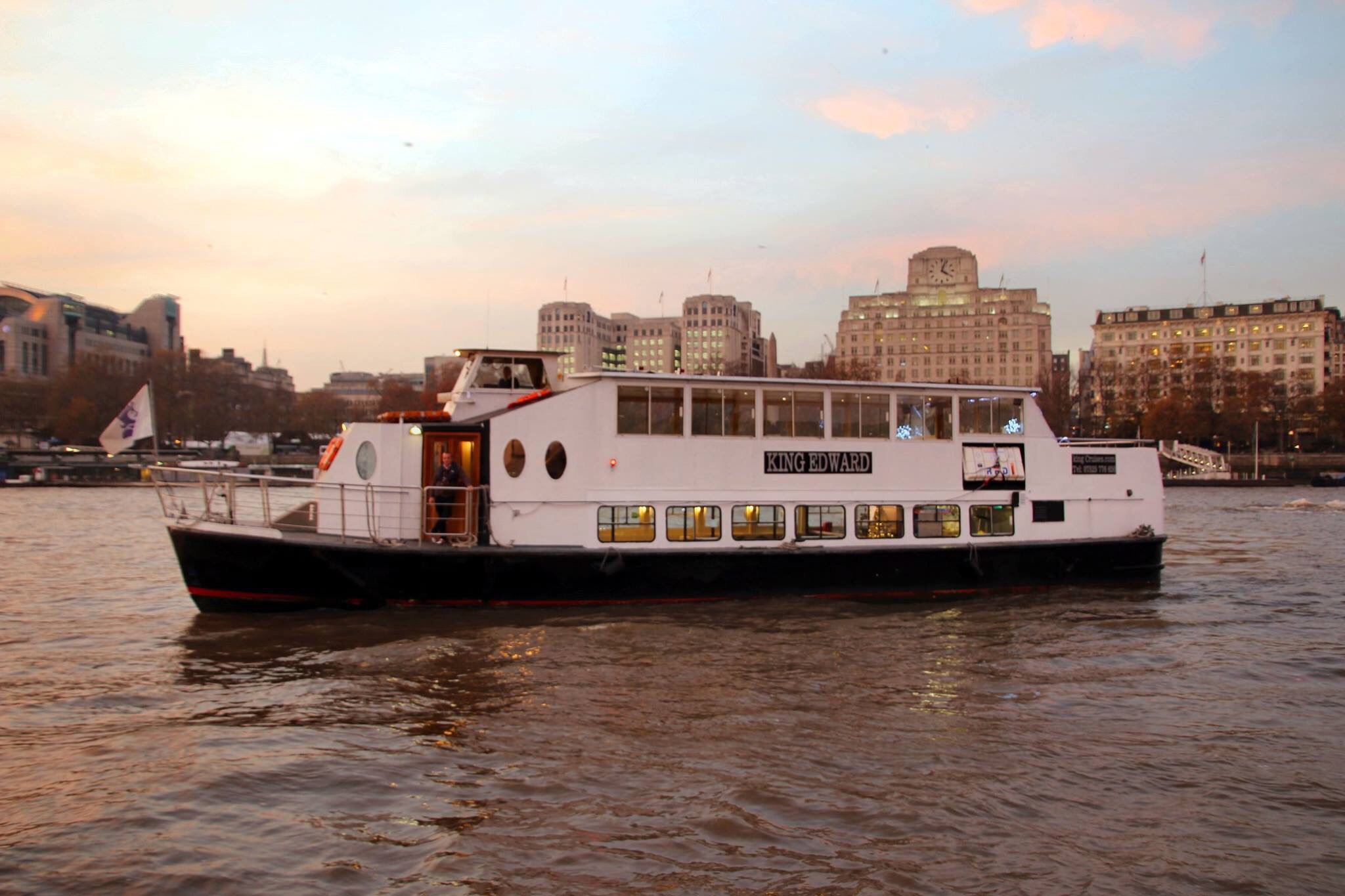 Stylish event boat with panoramic windows for unique gatherings on the river.